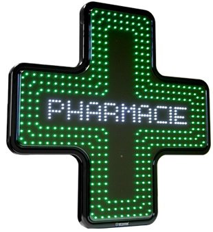 Verlicht groen kruis van een apotheek, het symbool van de apotheken in Carnac