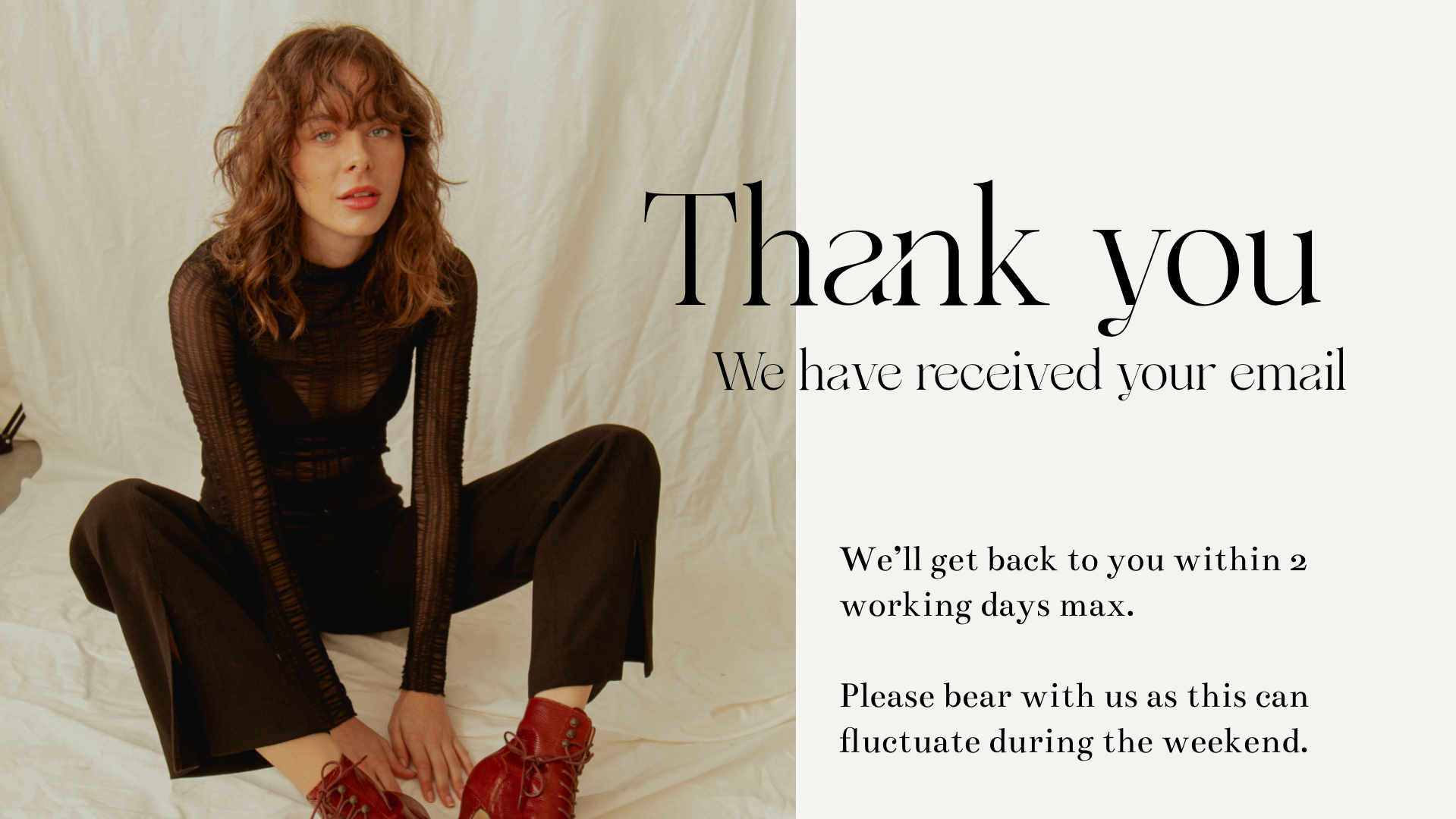 A woman with curly red hair wearing a black sheer long-sleeve top and black pants, sitting on a white fabric background with her legs crossed, and red boots. Next to her, a message thanking the recipient for their email and mentioning a response within two working days, with additional instructions.