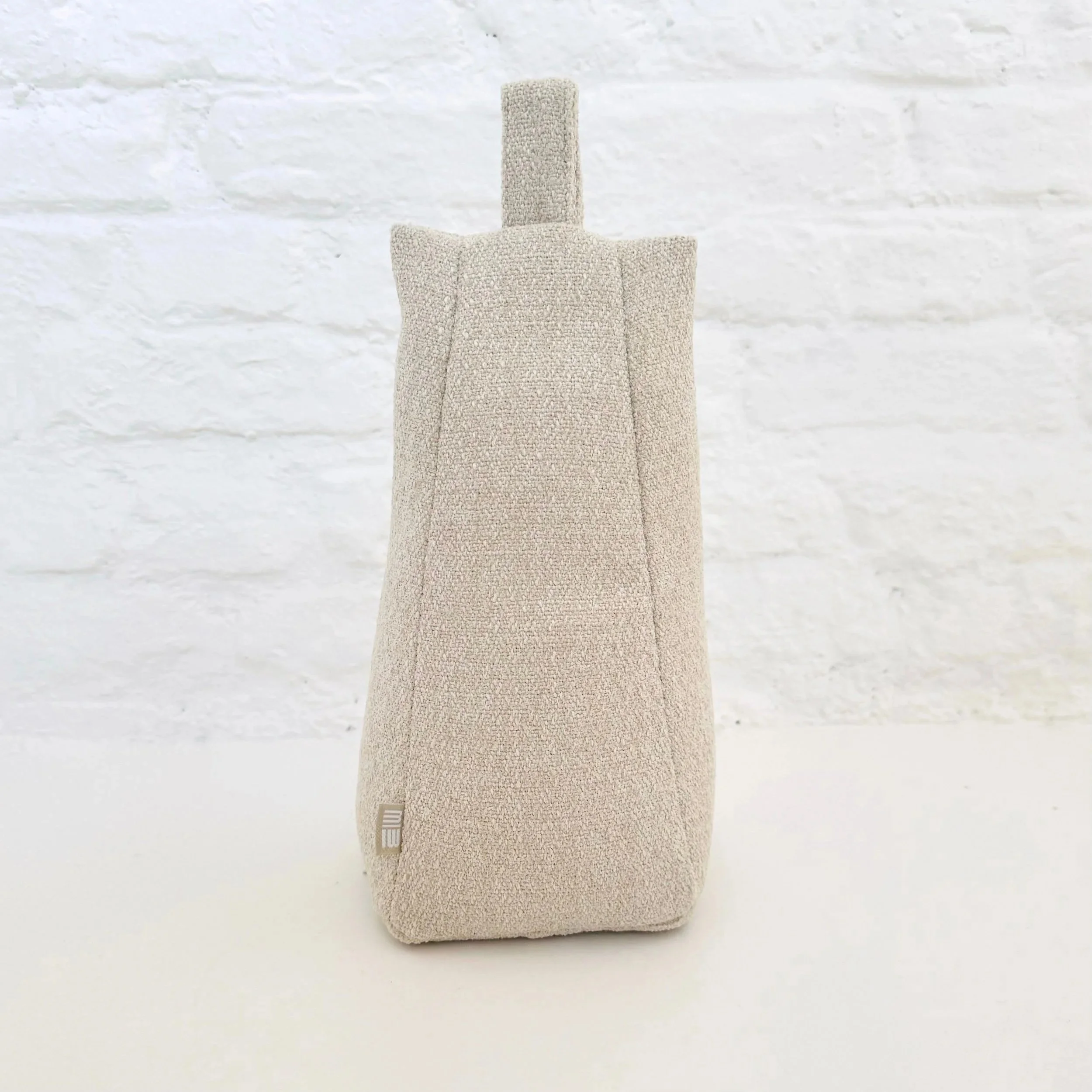 cremekleurige design deurstopper of deurklinkbuffer