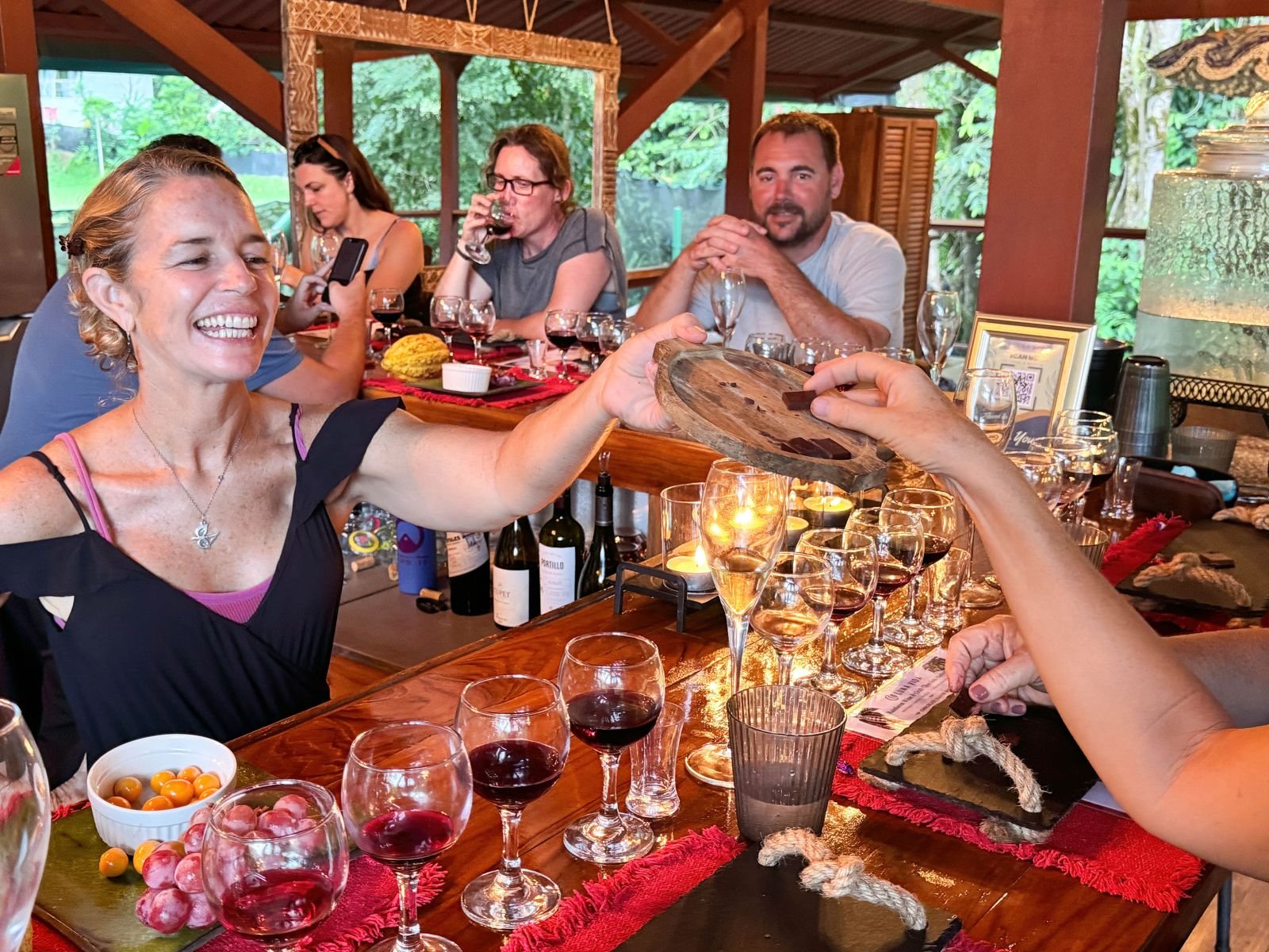 Guests enjoying a relaxed wine and Costa Rican craft chocolate and local coffee tasting at Chorro Ecolodge near Manuel Antonio, Costa Rica.
