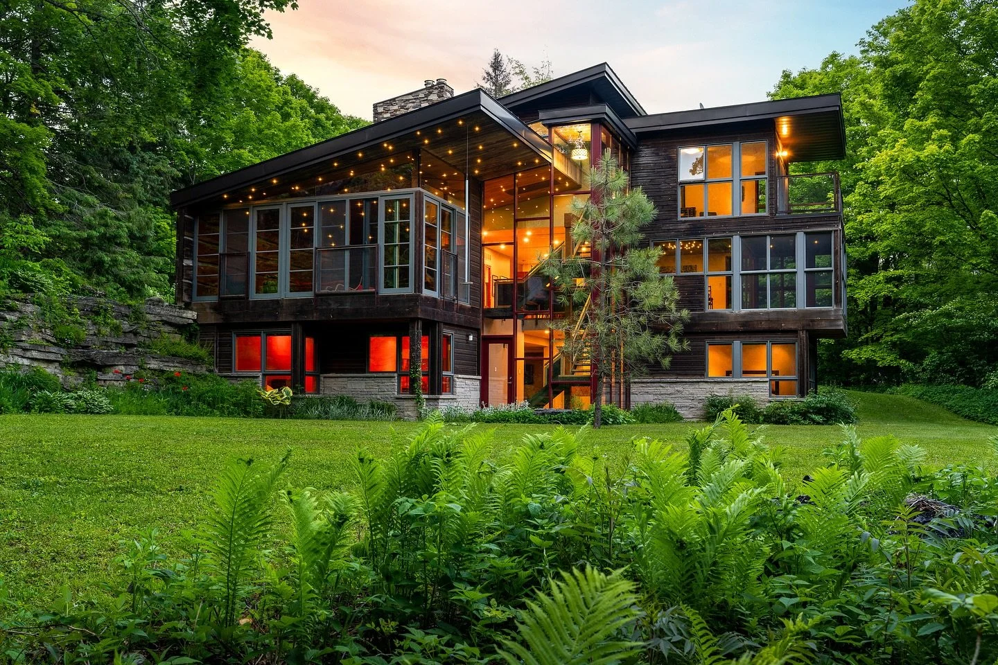 🌿✨ Experience Nature and Architectural Excellence in One Home ✨🌿

Built in 2012, this stunning custom residence sits on nearly 5 acres with the tranquil Pine River flowing through its property. A perfect blend of stone, wood, metal, and glass creat