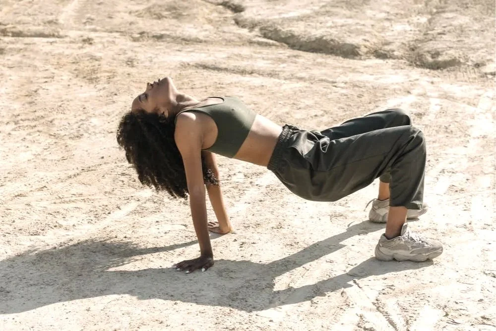 Person stretching outdoors representing digestive wellness and overall well-being associated with colon hydrotherapy in Atlanta