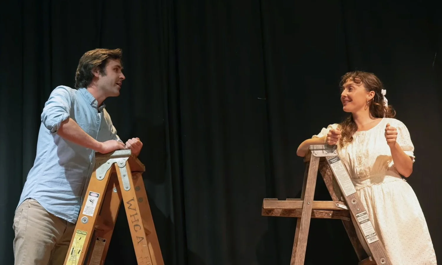  Emma K. Miles, auburn haired leading lady, performs in the Woods Hole Theater production of Our Town, on stage with her cast mate. 