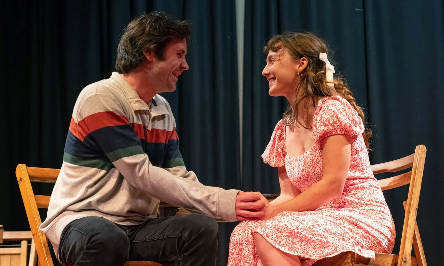  Emma K. Miles, a Cape Cod based actress, in character and seated on stage alongside her scene partner in the theatrical performance of Our Town. 