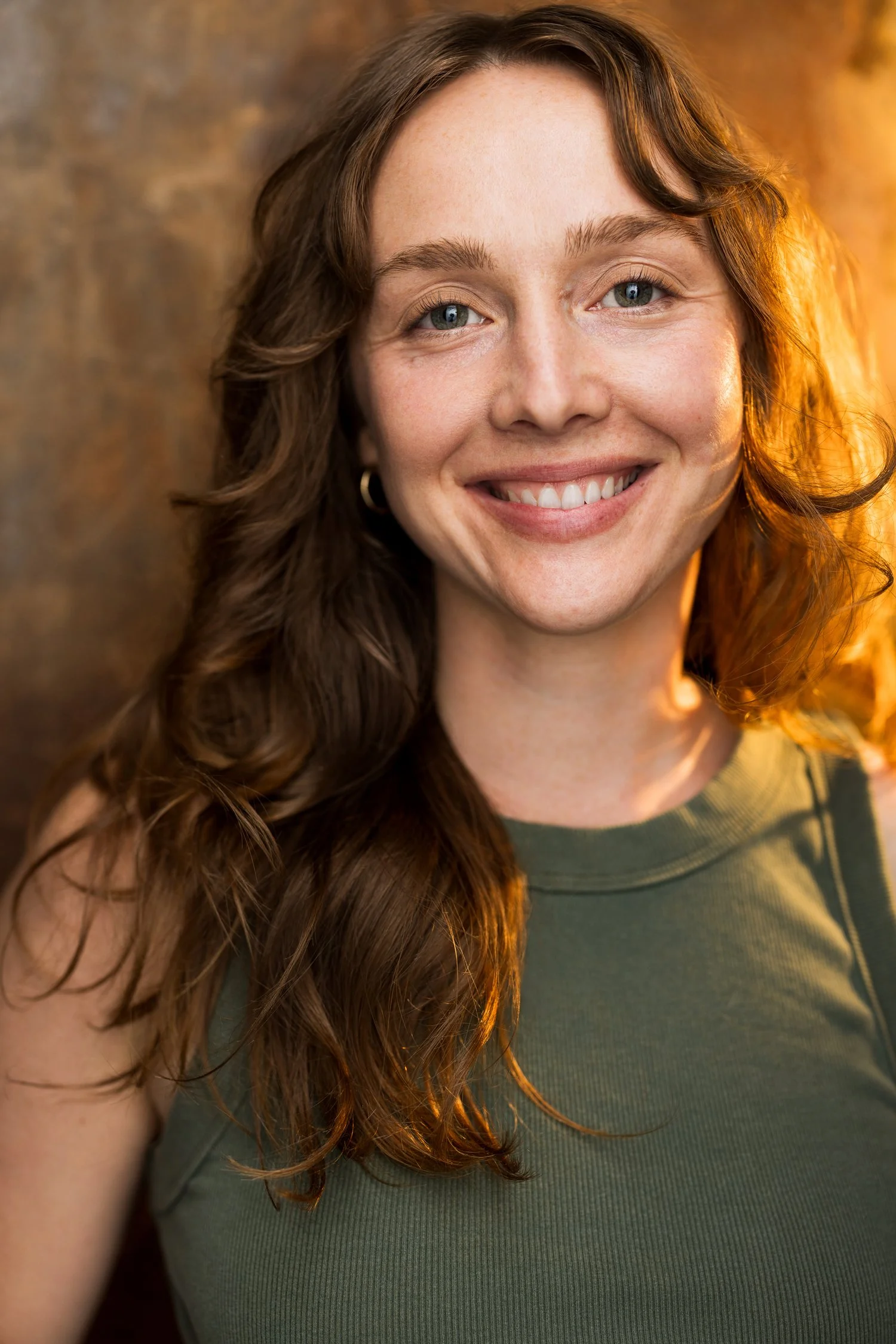 Emma K. Miles an auburn haired actress smiling