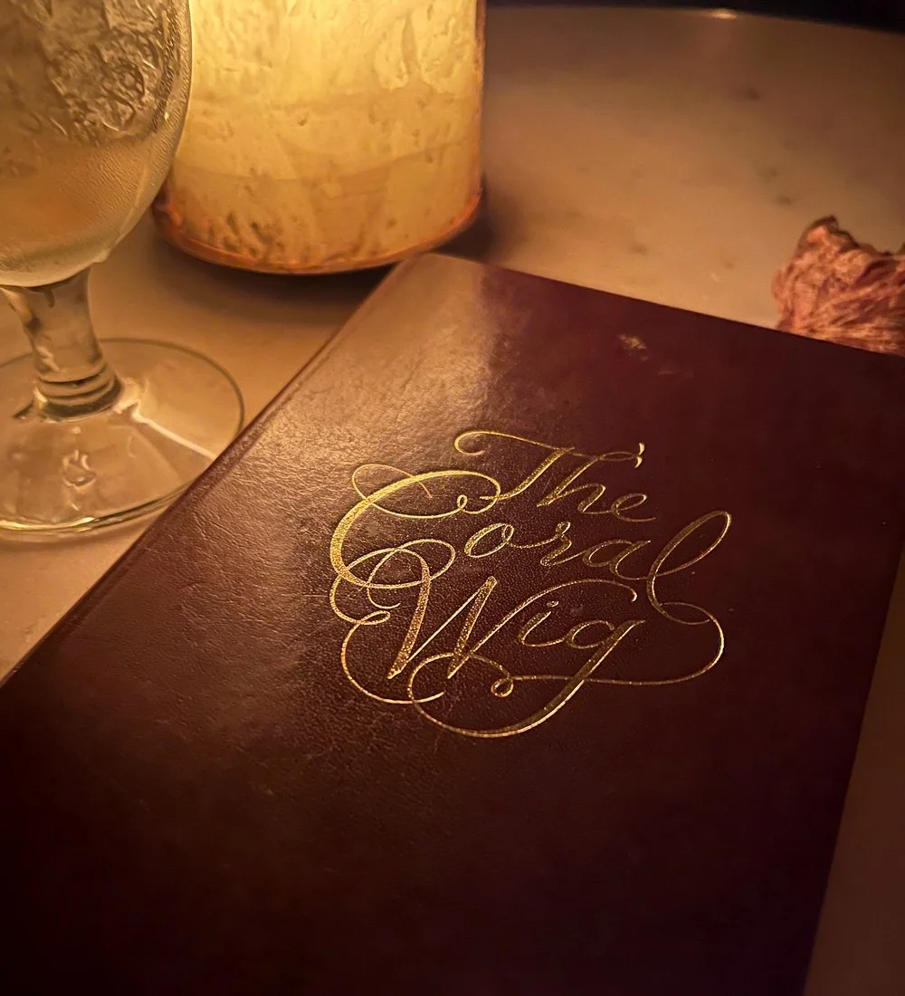 The Coral Wig menu debossed gold foil