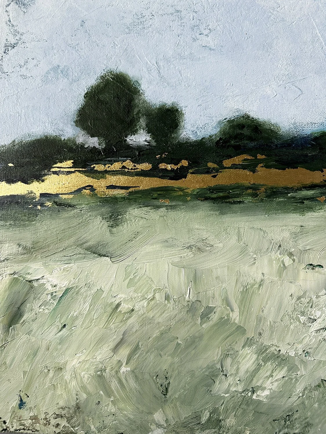 Close-up detail of textured green acrylic textured detail in a large landscape painting.