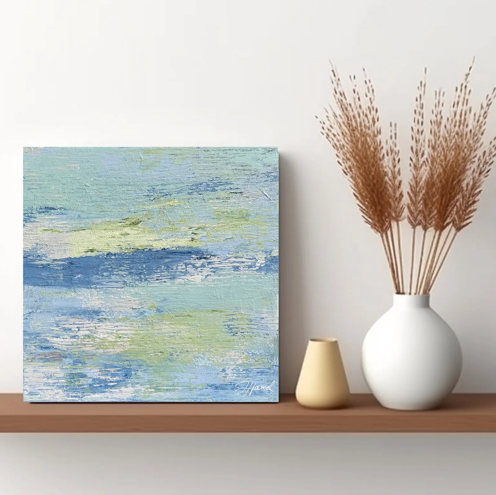 Small original abstract pastel waters painting displayed on a shelf.