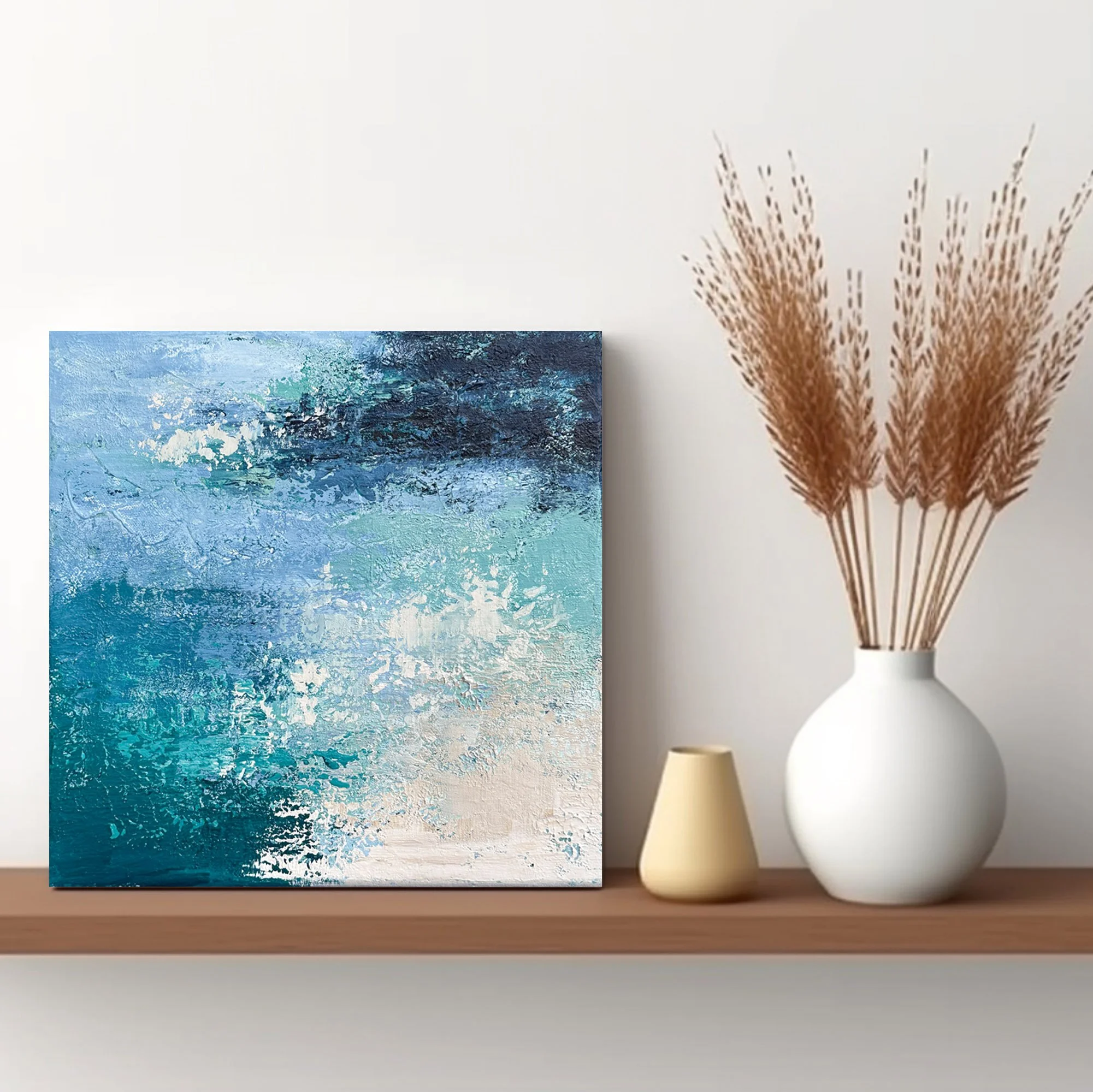 Small original abstract water painting displayed on a shelf.