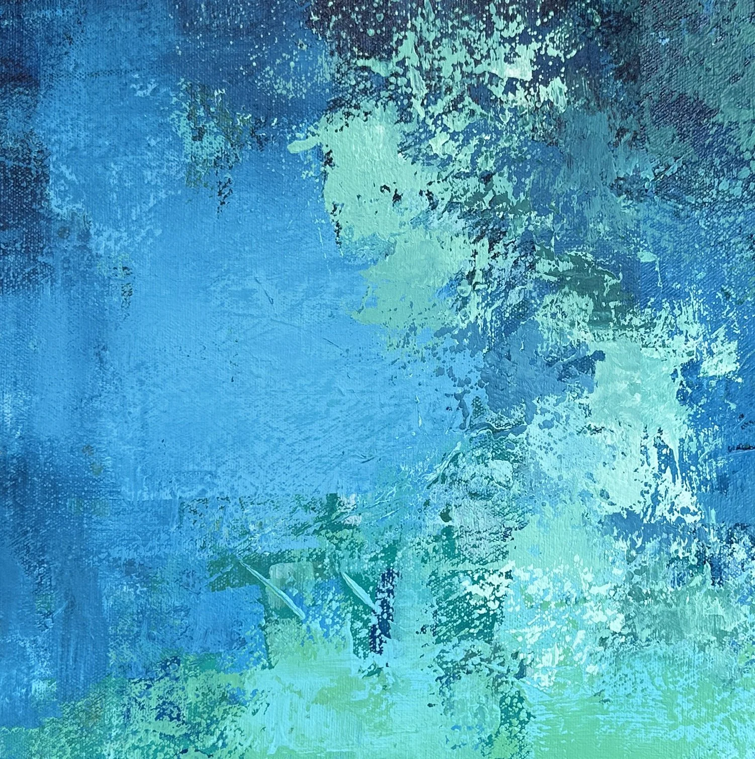 Close-up detail of the expressive palette knife texture in a blue abstract water painting.