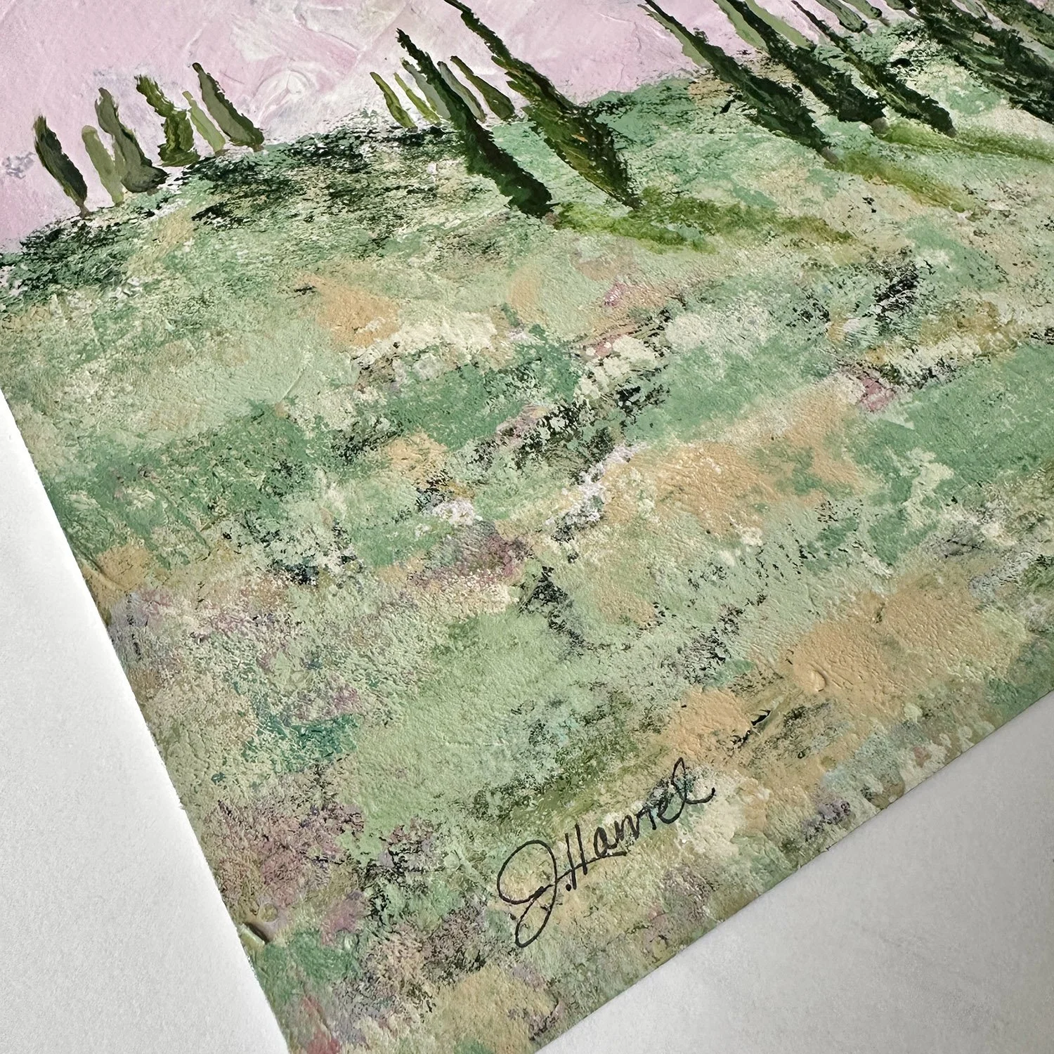 Close-up corner detail of "Dolce Cypress Dreams," showing abstract brushwork in gold and soft green hues evoking a sun-drenched Tuscan meadow.