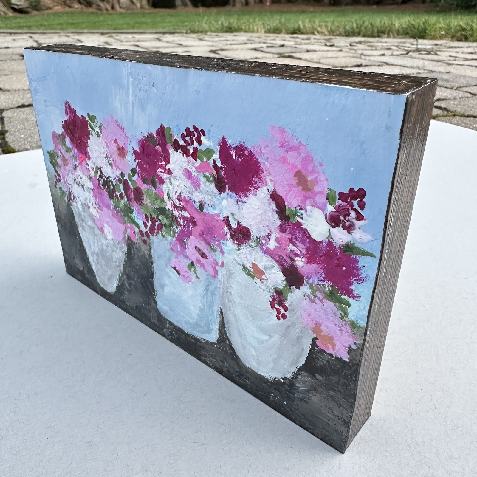 Small floral art on a cradle board