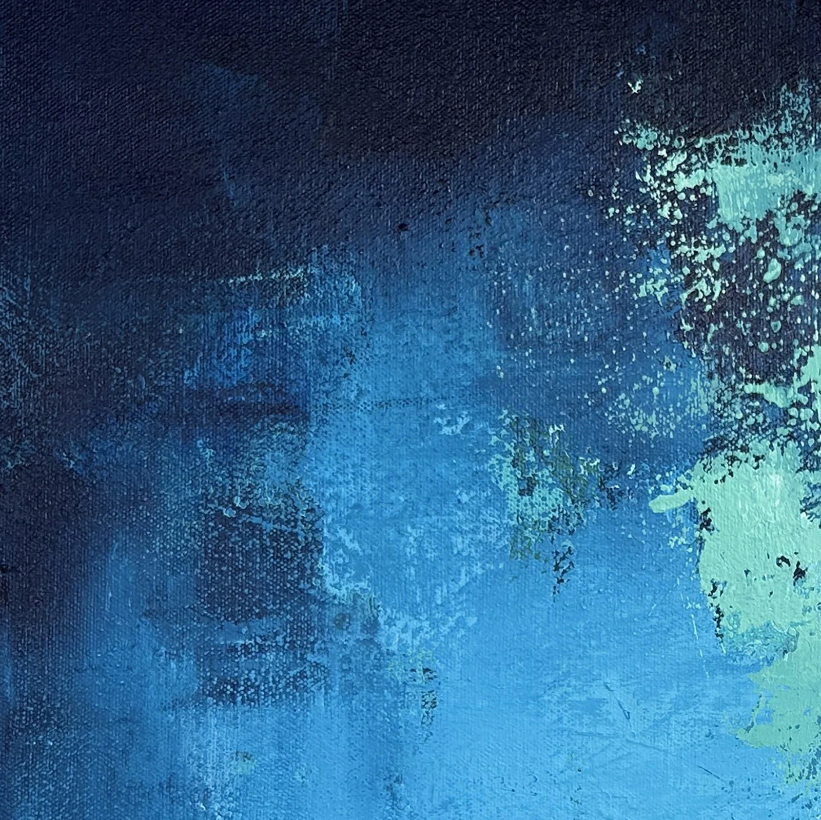 Close-up detail of the expressive palette knife texture in a blue abstract water painting.