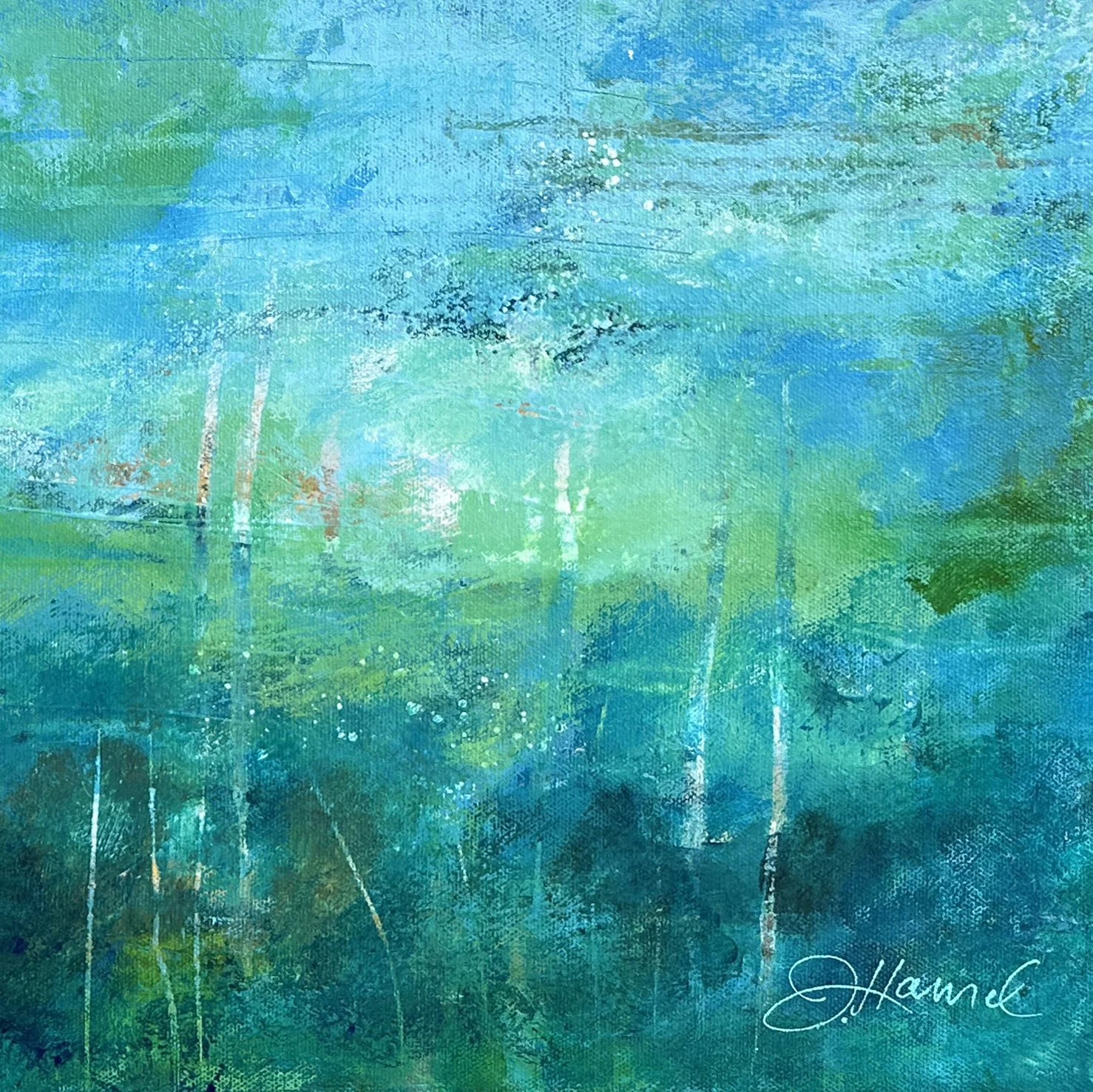 Close-up detail of the layering of vibrant colors in a blue abstract water painting.