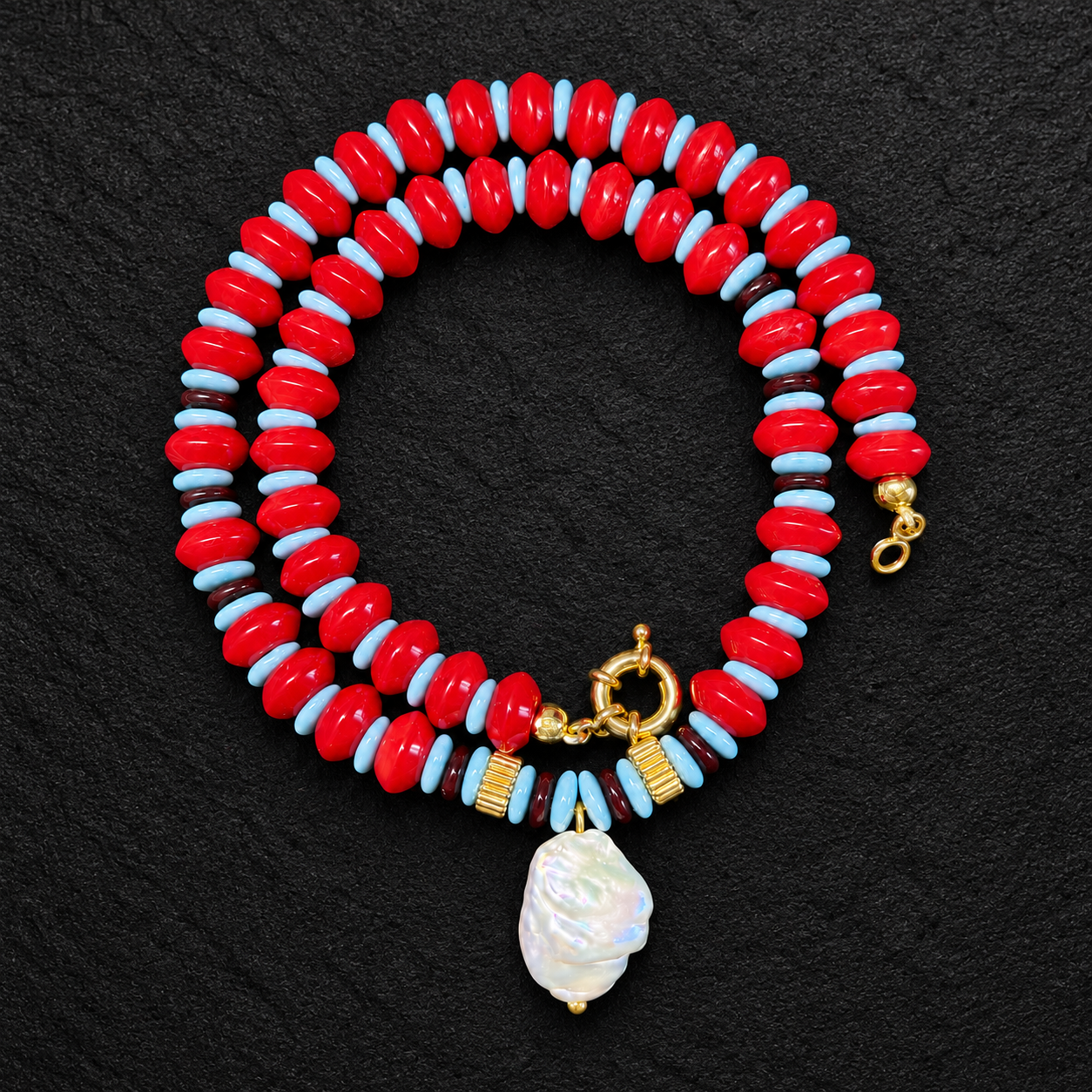 Baroque Pearl Necklace on Textured Black Stone.png