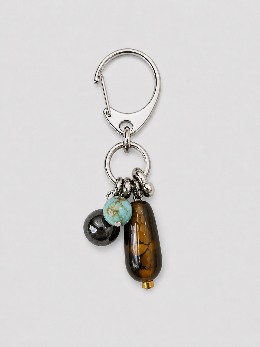 Handcrafted turquoise stone keychain with agate bead and stainless steel hardware.