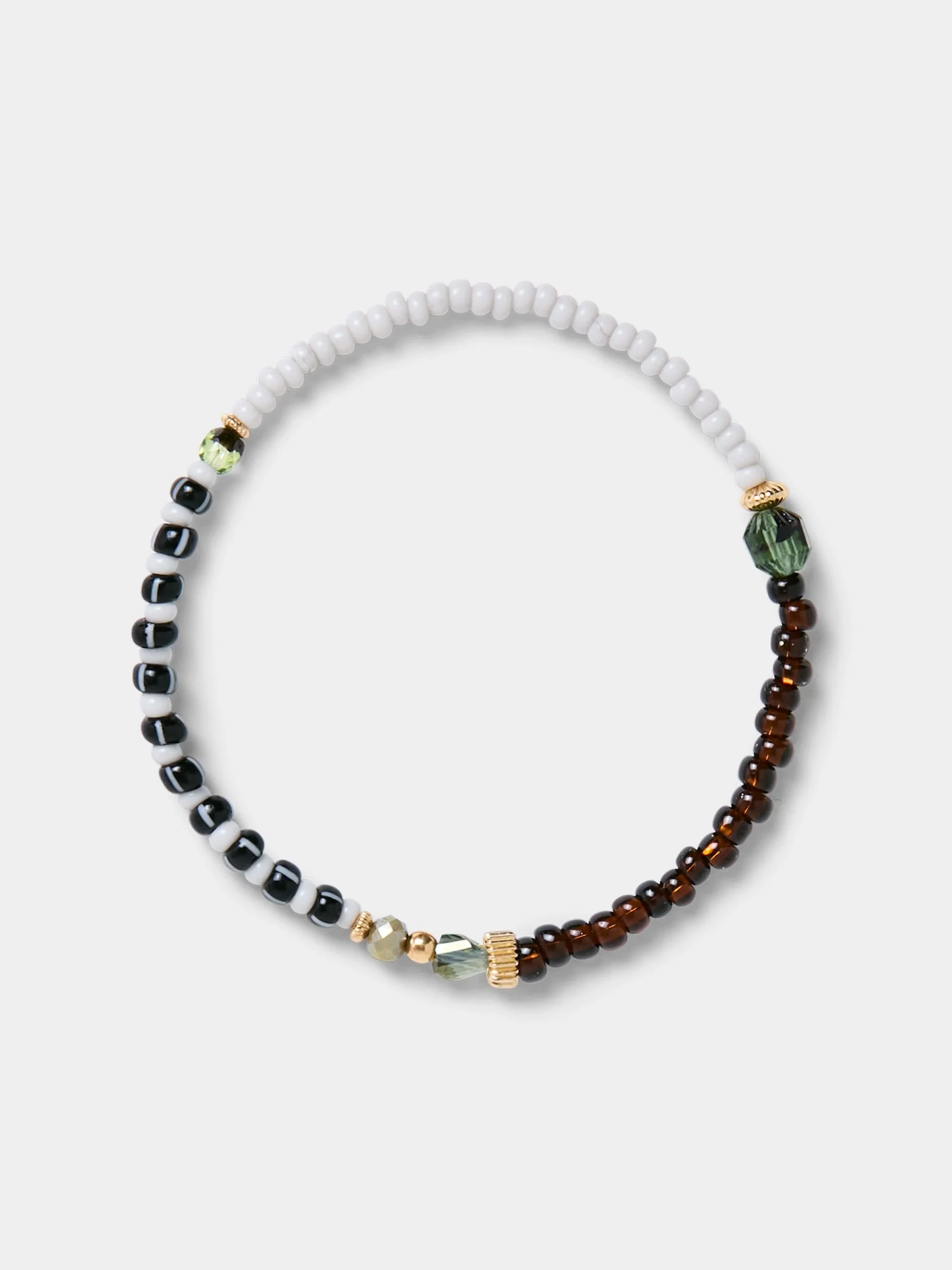 Beaded necklace with white, black, green, gold, and brown beads displayed against a light gray background.