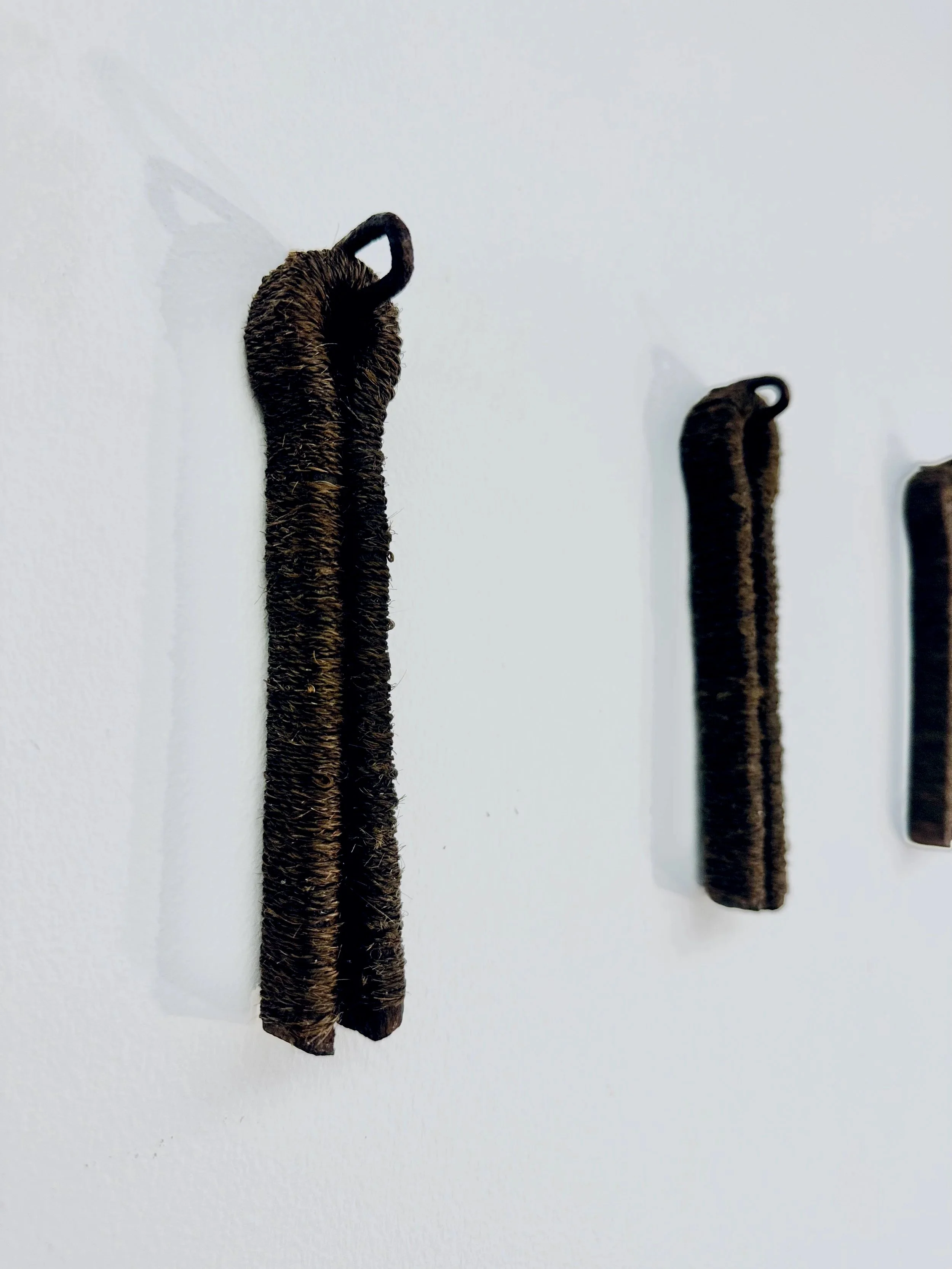 'Earth bound' (detail), 2024
The artist's hair with found railway cotter pins.
9 pins, each approximately 15 x 3 x 2cm. 
