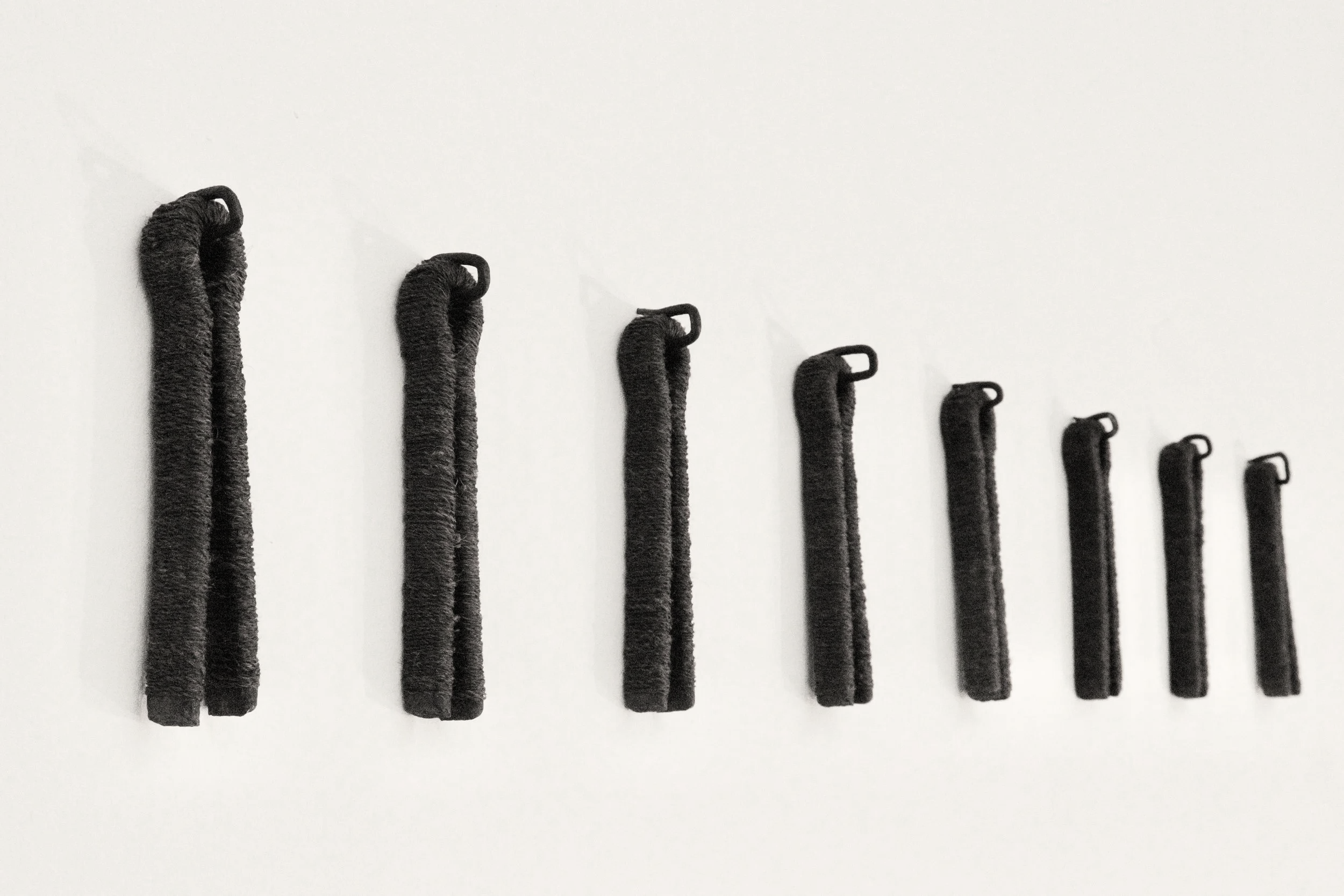 'Earth bound', 2024
The artist's hair with found railway cotter pins.
9 pins, each approximately 15 x 3 x 2cm. 