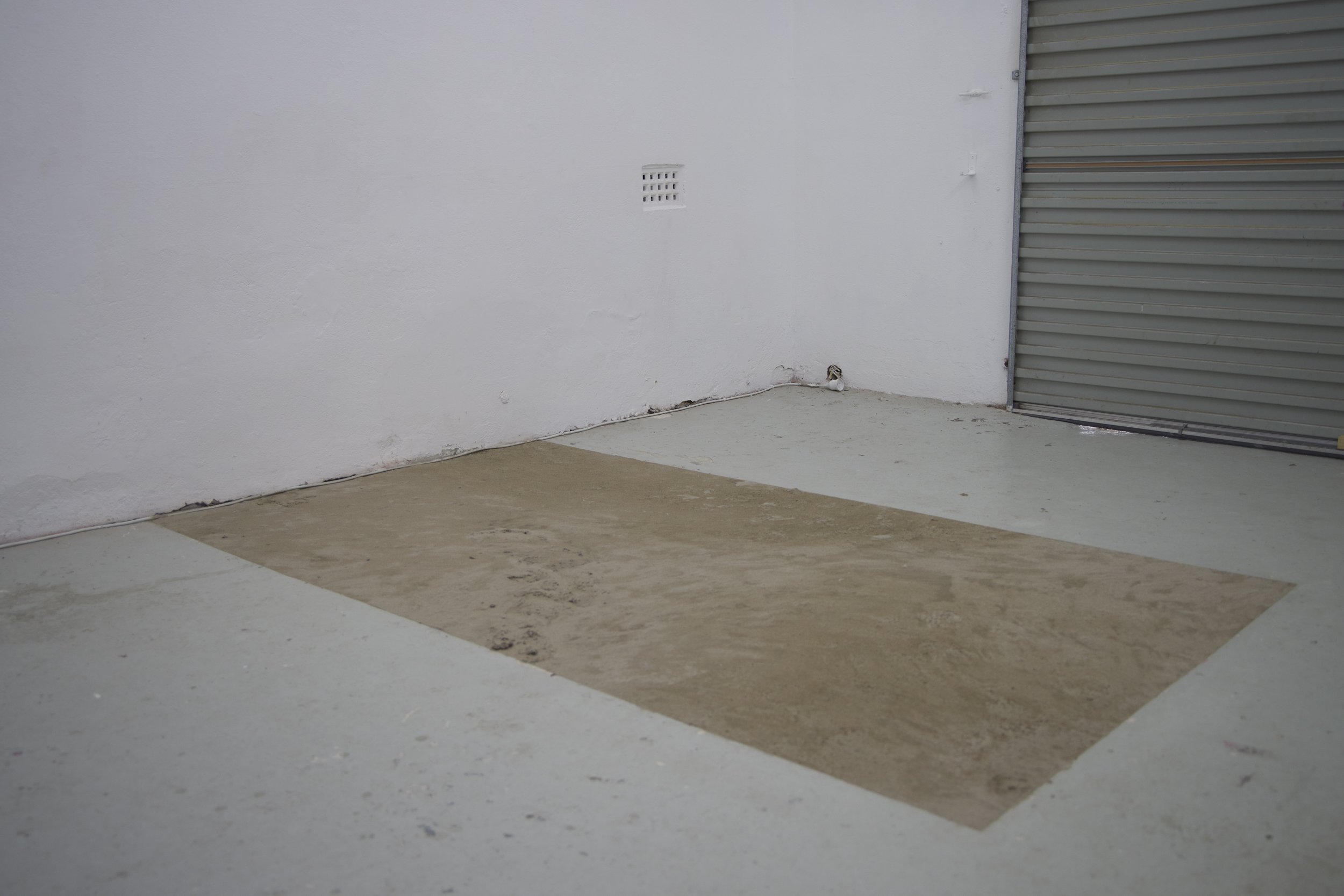 'Tender ground' (installation view), 2025
Site-specific installation. 
Found and discarded materials (cement mortar, acrylic lacquer, PVA).
201 x 145cm. 
Photo courtesy of Puzzle Gallery, Chippendale