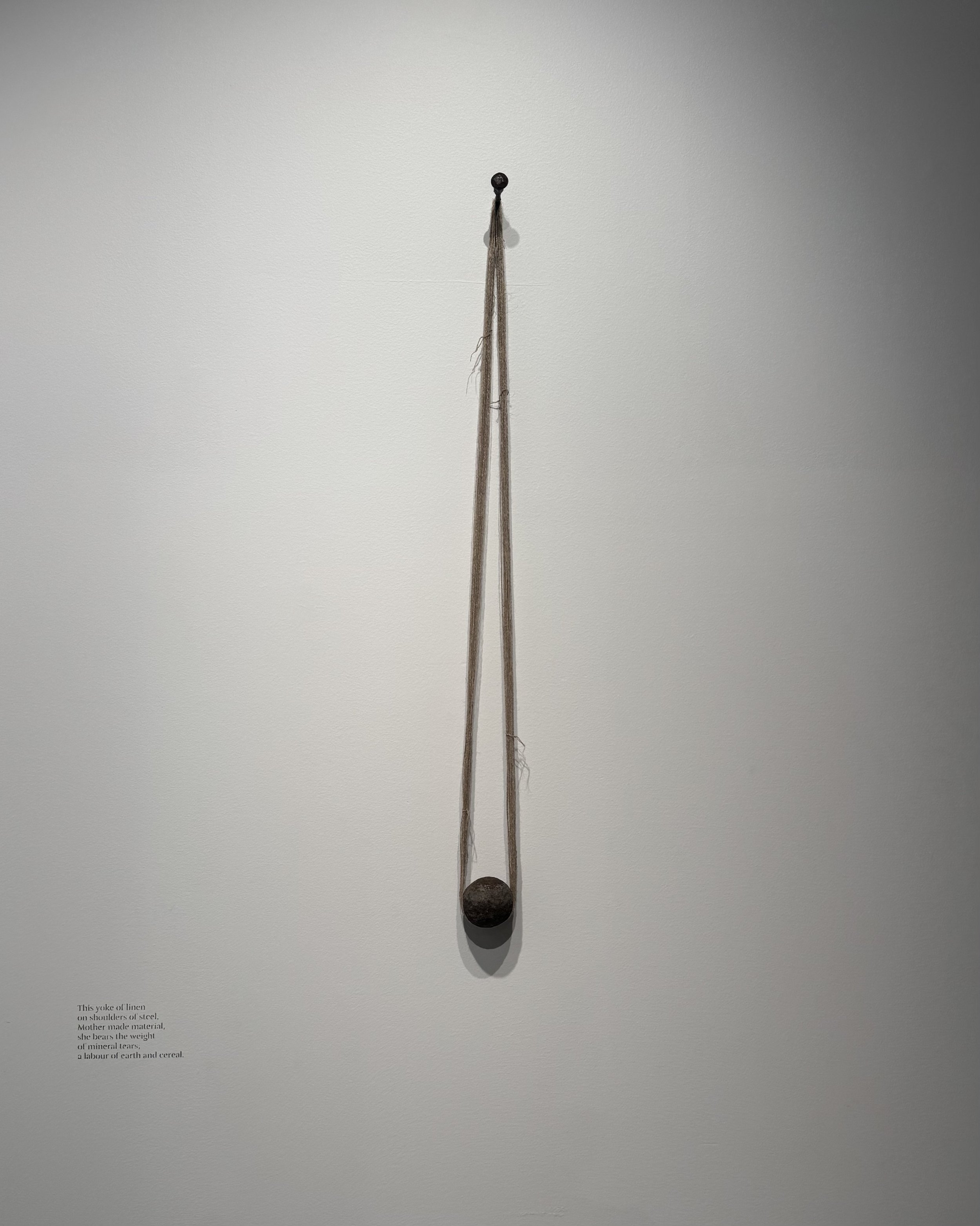 'Yoke (the weight of the world), 2025.
Steel mill ball found on Wiradjuri land at the former Portland cement quarry, NSW. Hung with hand-spun, two-ply flax linen and a steel nail, found on Yuin country at 'Ford's farm' (now a pile of disused tin roof