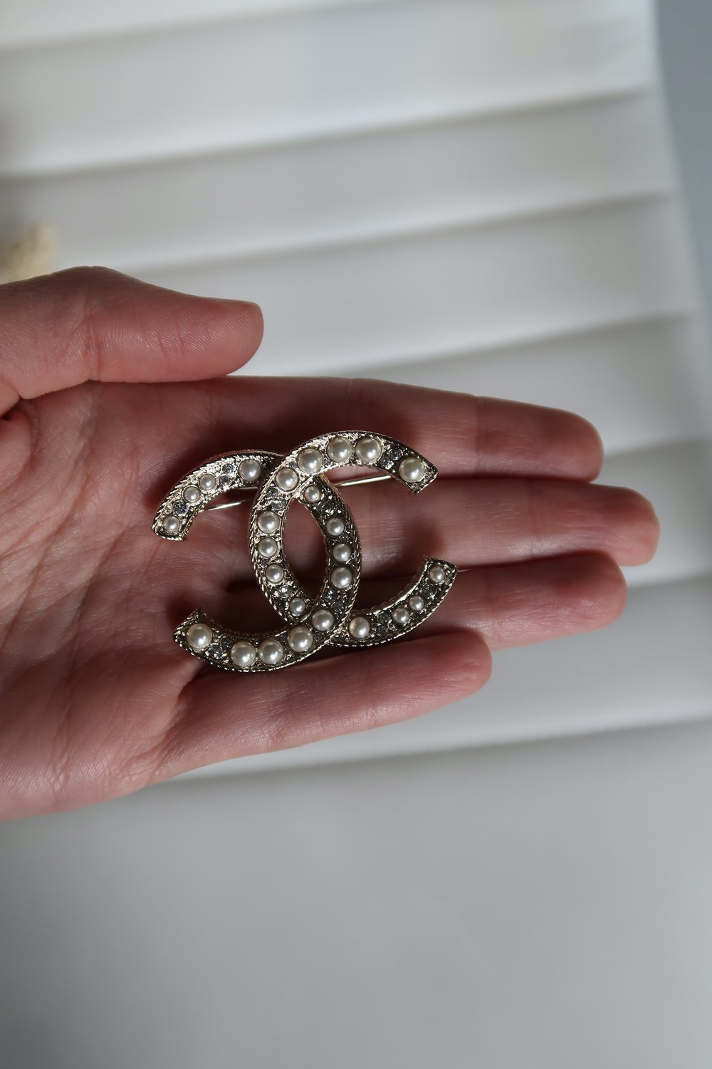 silver chanel pin brooch