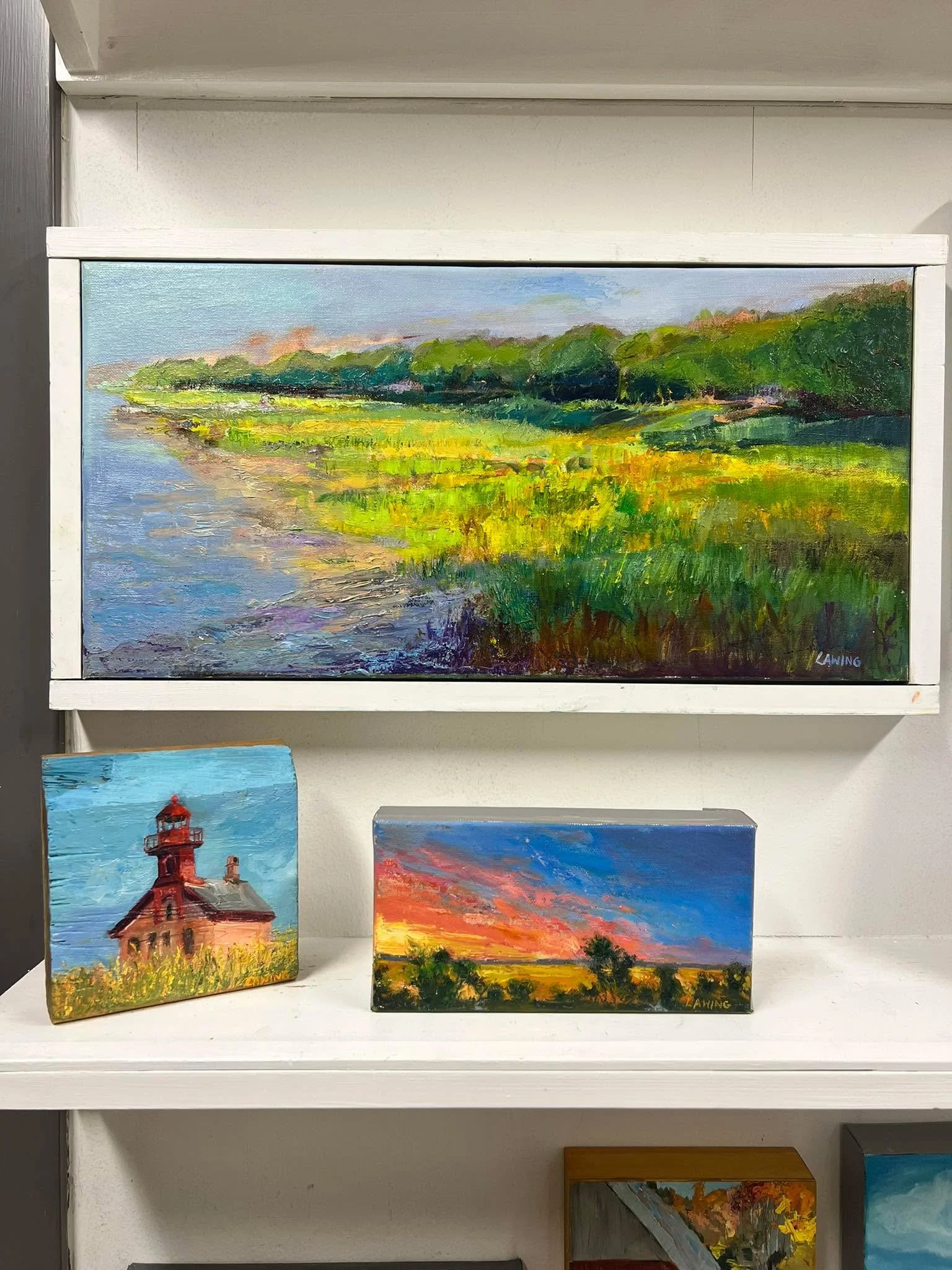 A sampling of smalls in my studio: Beaufort&rsquo;s Bay Street view, a Fripp Island sunset, and Block Island&rsquo;s North Light. 
10x20 oil + acrylic on canvas; 4x8 oil on canvas; and 5x5 oil on found wood. Available.