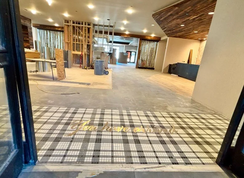 🧩 DETAIL // Our Steamboat project started with a vision for this custom entry tile mosaic. Every piece thoughtfully planned, the brass inlay precisely placed to guide the eye and ground the space. Walking through the doors becomes an experience wher