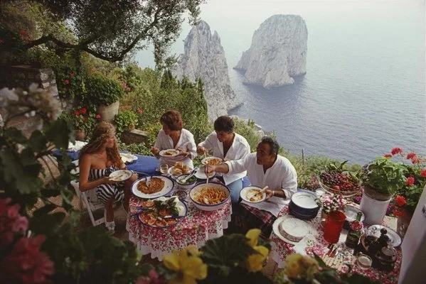 dining-al-fresco-on-capri-c-print-framed-in-black-by-slim-aarons-2.jpeg