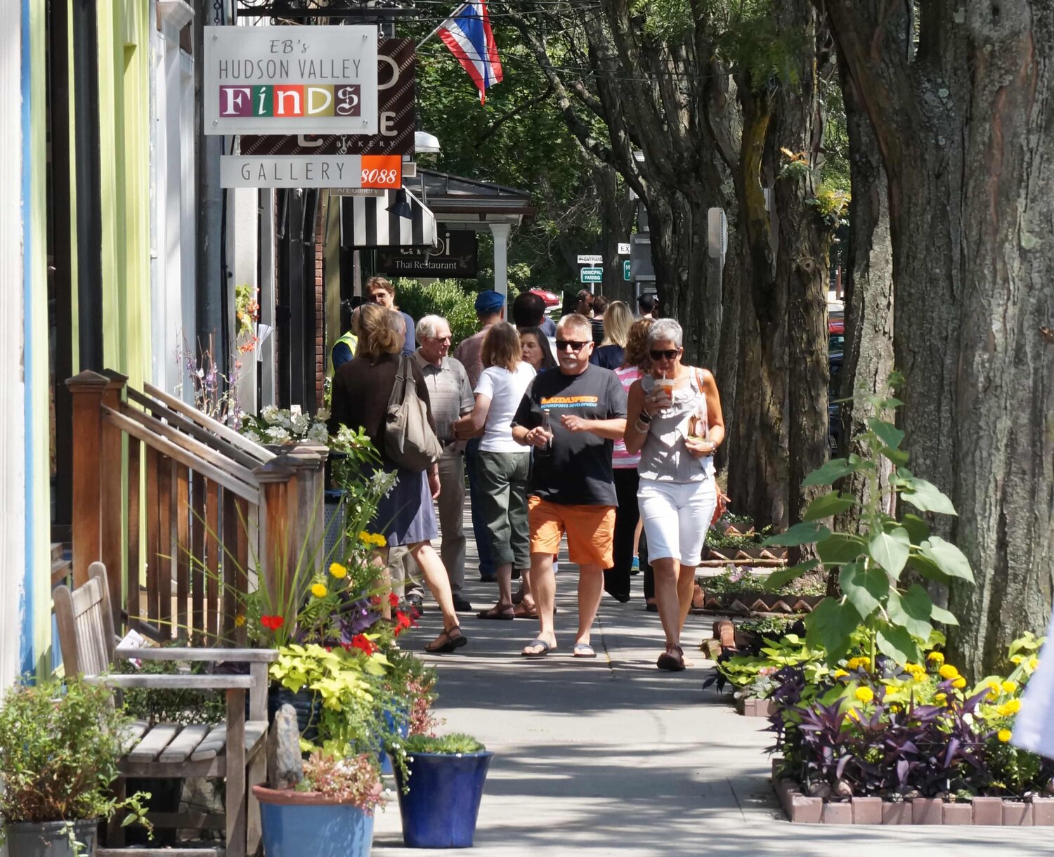 An attractive streetscape palette includes perpendicular signage, seating and steps, and sensory cues including scent and color.