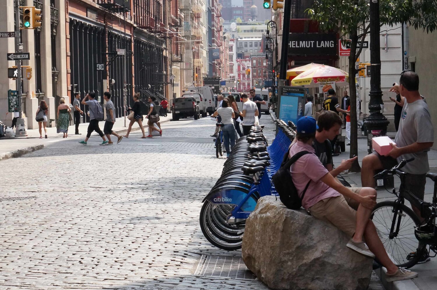 All manner of objects can become part of making a street “sticky,” i.e. a street that convinces people to gather and stay rather than just walk by. Clustering them by building entrances can support both businesses and users.