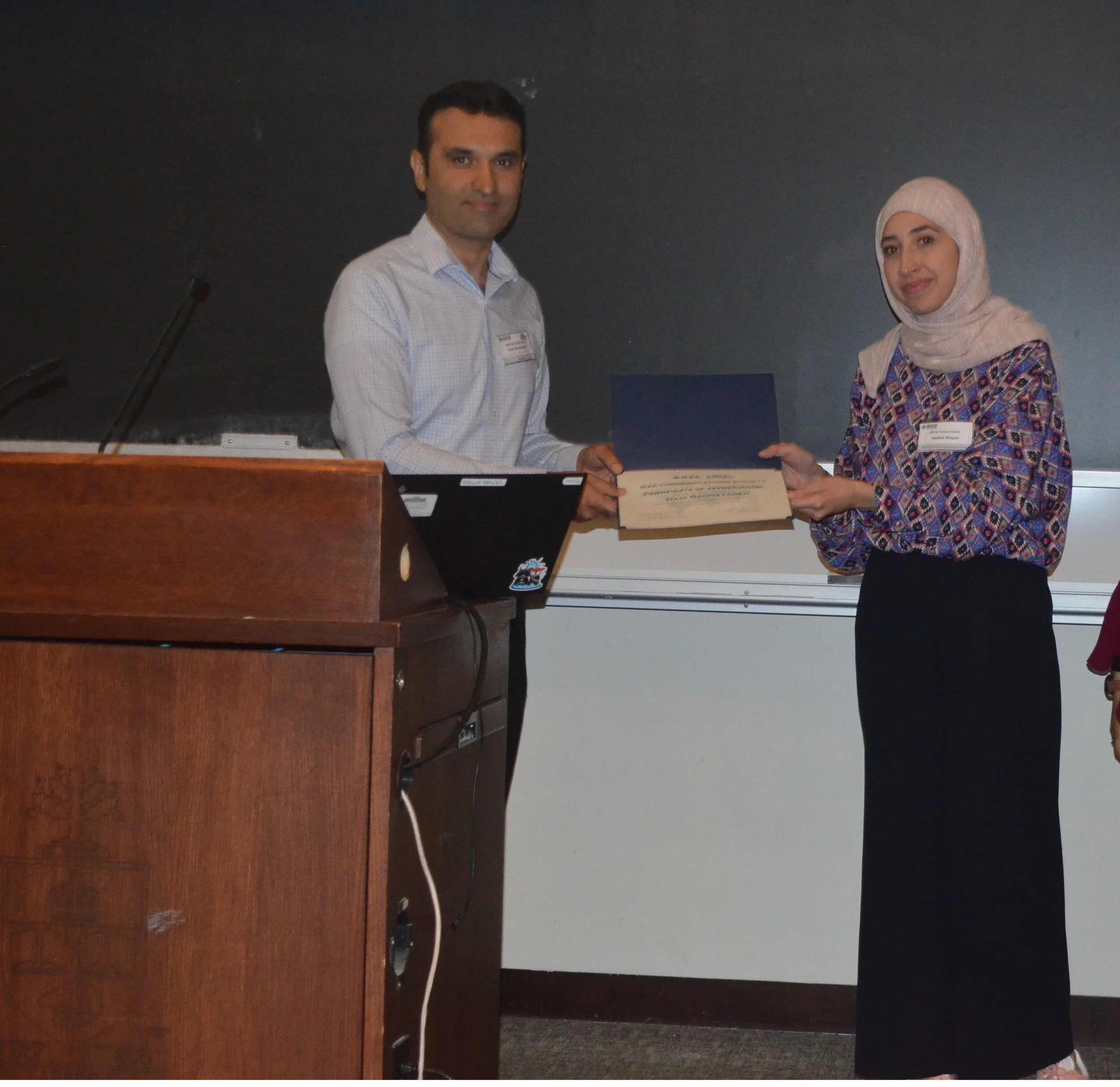 Distributing certificates to participants in the 5G Toronto Summit held at University of Toronto in 2019.