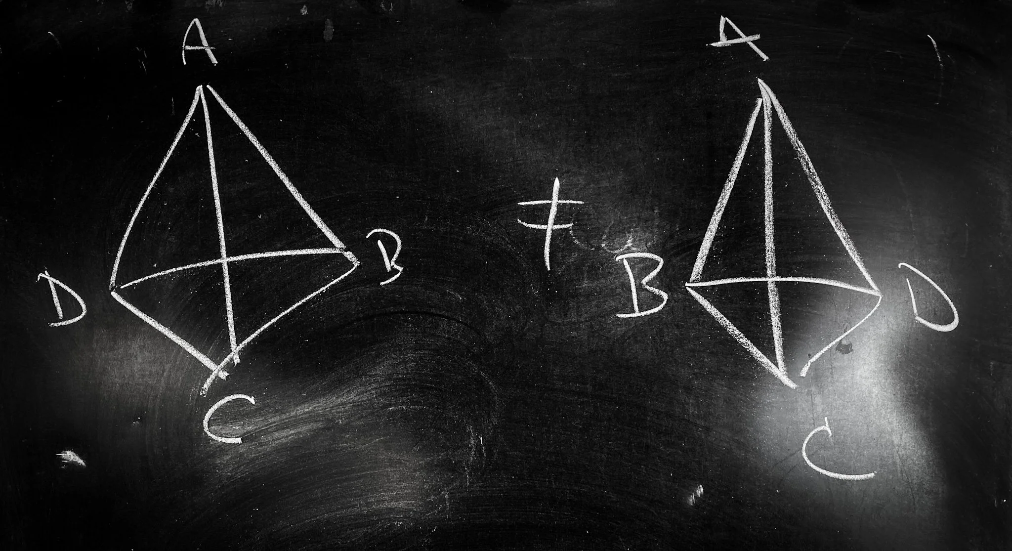 Two tetrahedra with labeled vertices that cannot be rotated into one another.