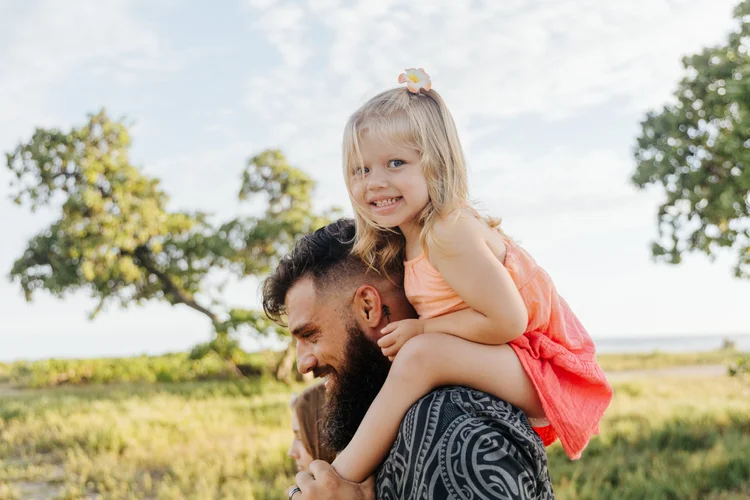 A family photographed under the trees on the resort grounds