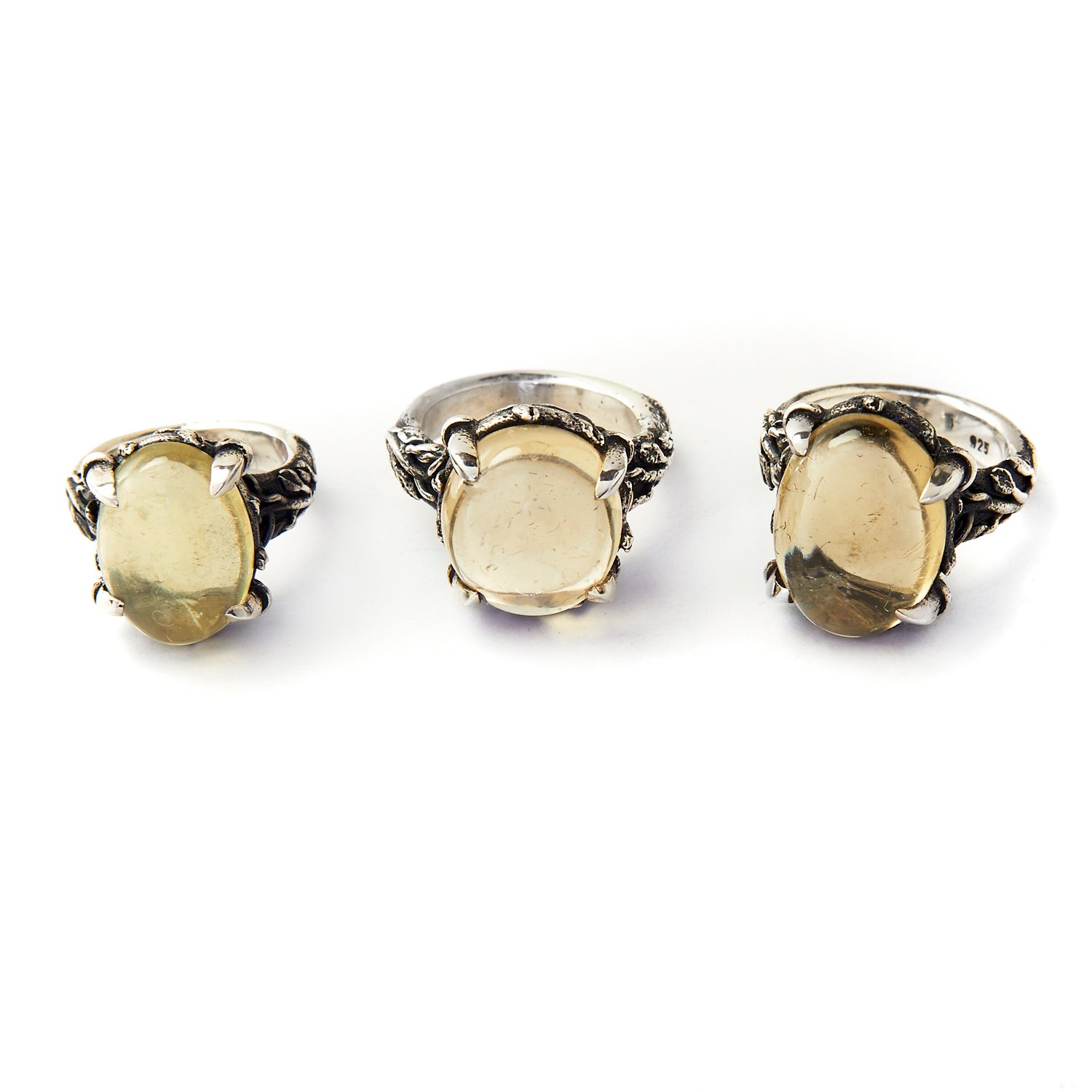 Big citrine cabochon set in Silver ring with fauna motive.