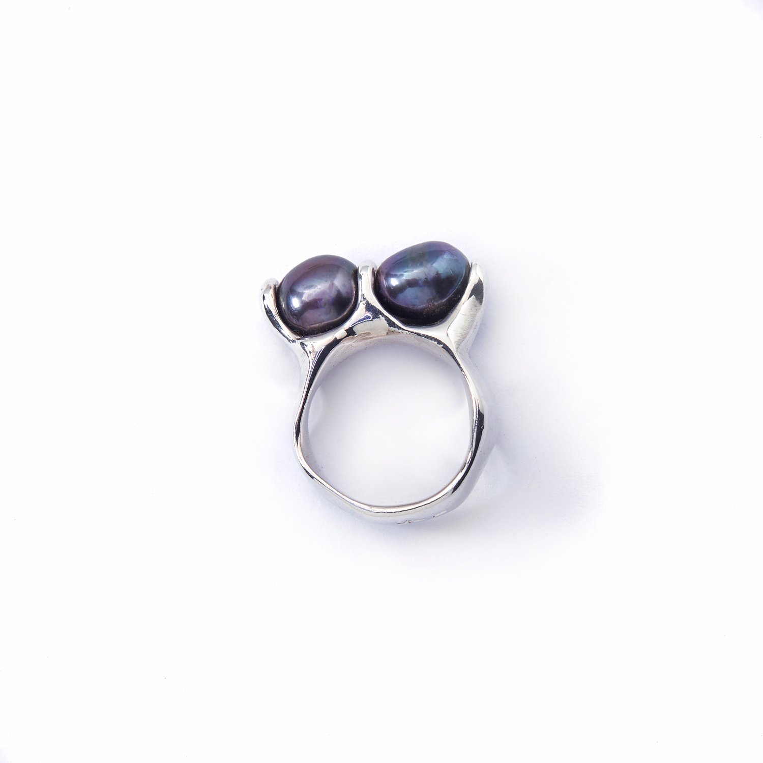 Two black river pearls set in organic freeform Silver setting.