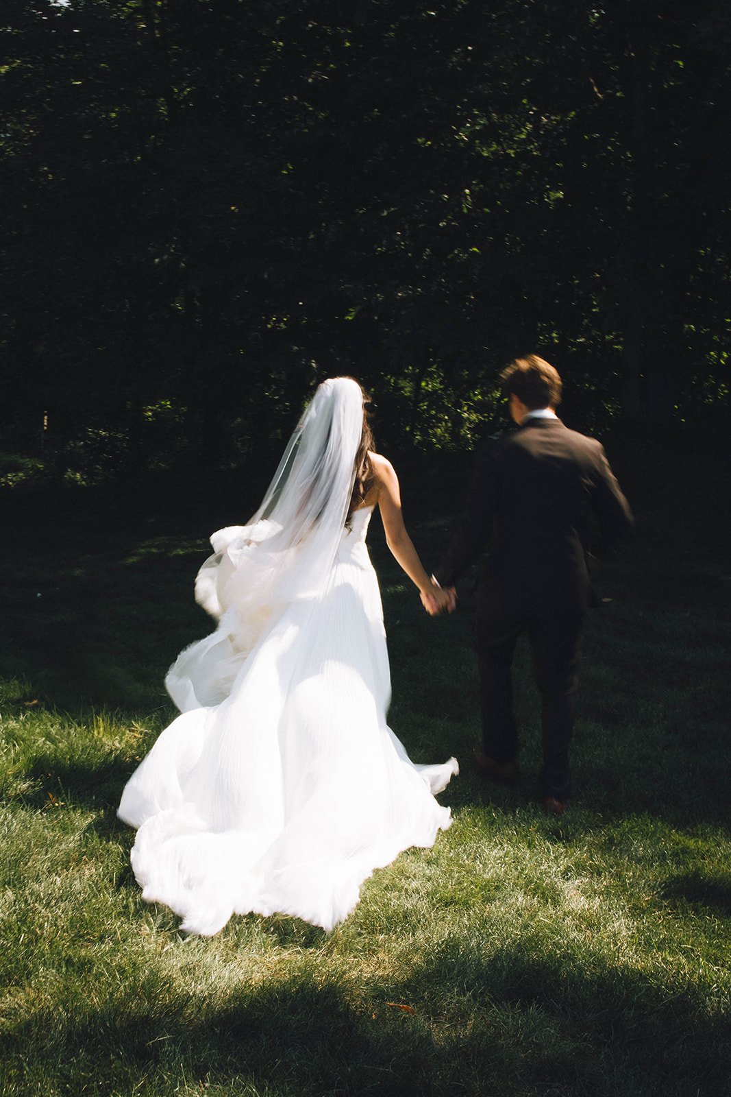 Bride and groom walking together at their intimate Rochester New York wedding