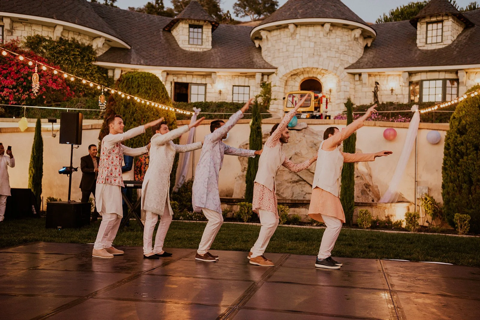 Wedding guests dancing during colorful California wedding weekend