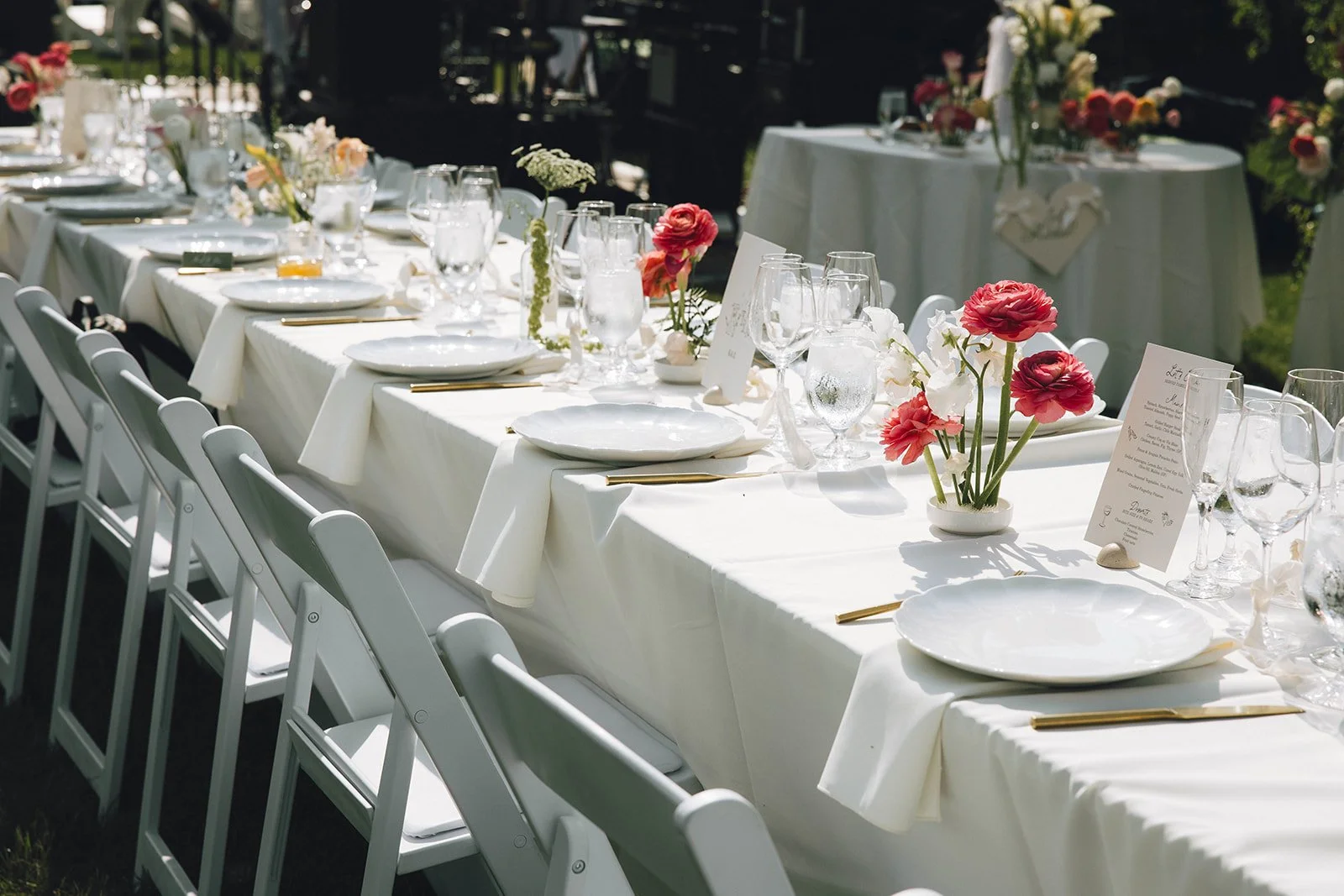 Wedding reception tables set beneath a tent for an intimate Upstate New York wedding