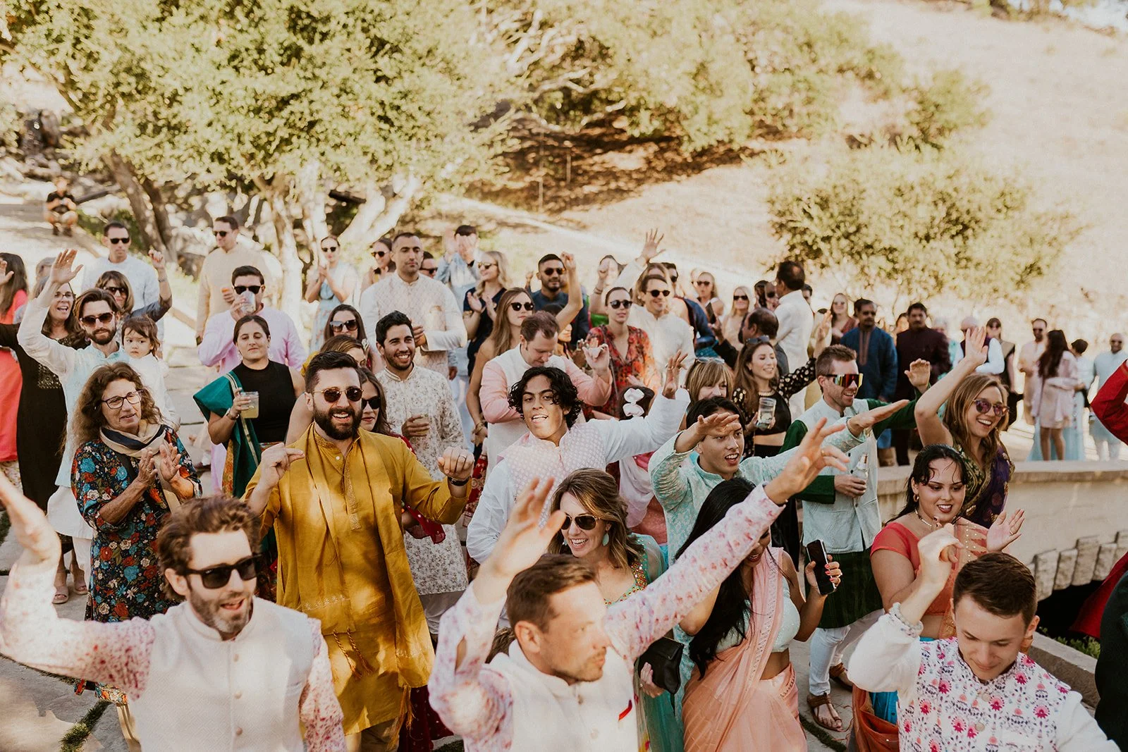 Guests celebrating during vibrant multicultural wedding reception