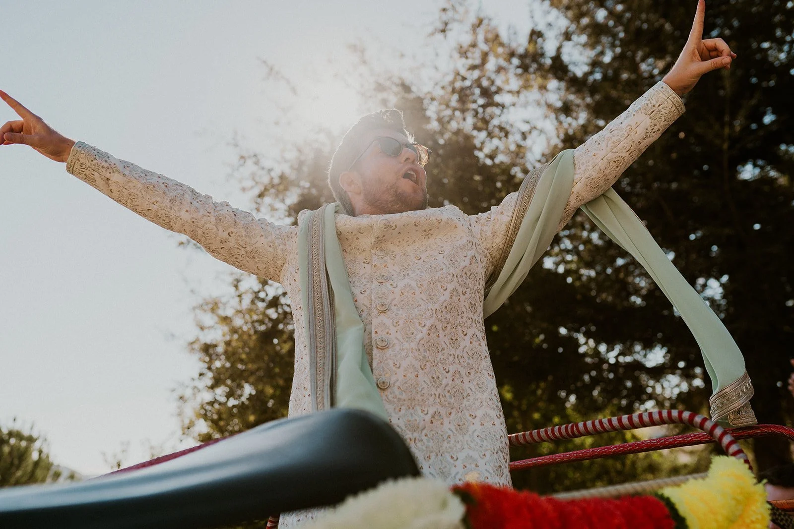 Groom dancing during joyful baraat celebration