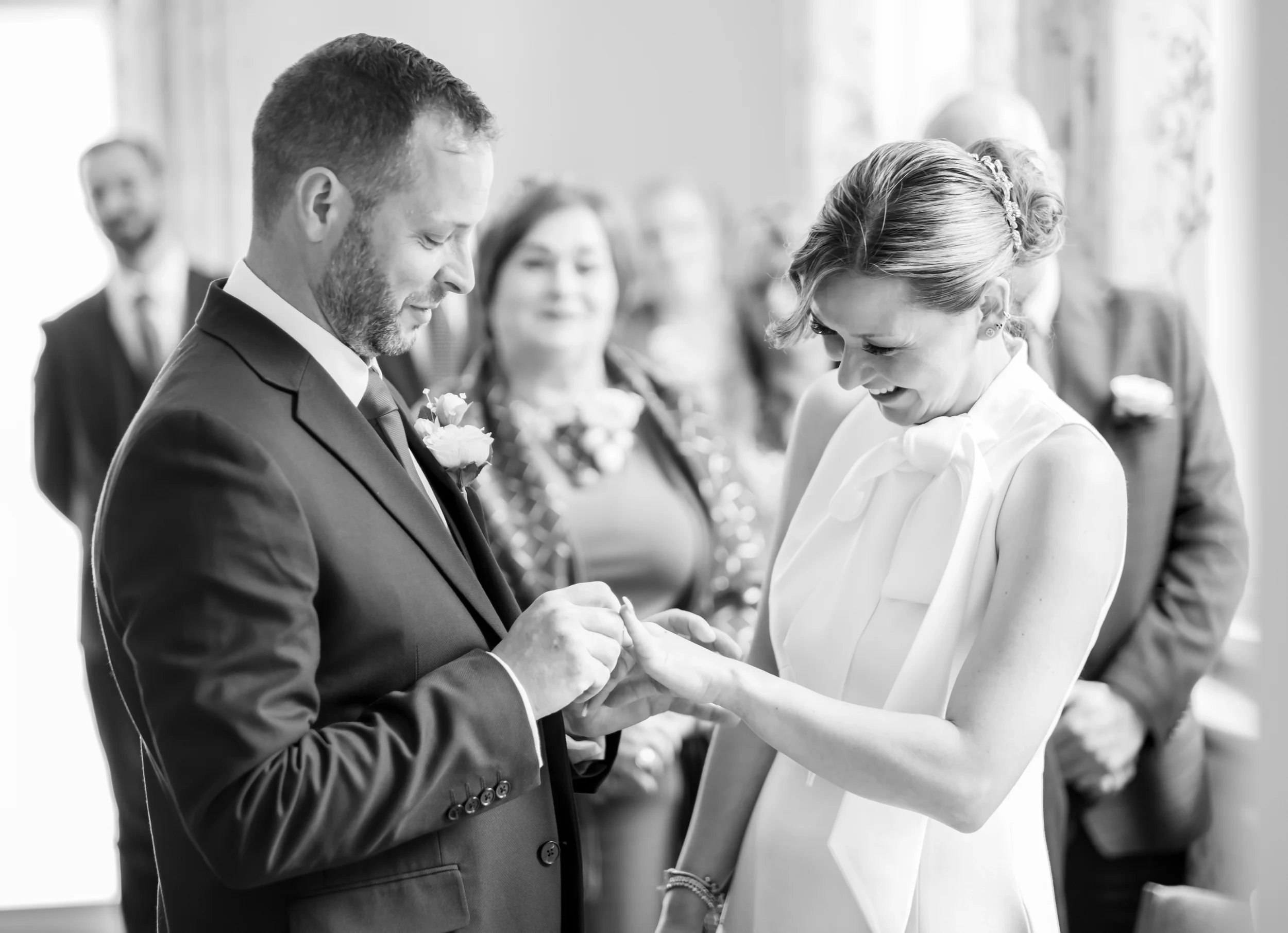 bedfordshire wedding photographer-photo of bride and groom exchanging rings on wedding day in Luton bedfordshire