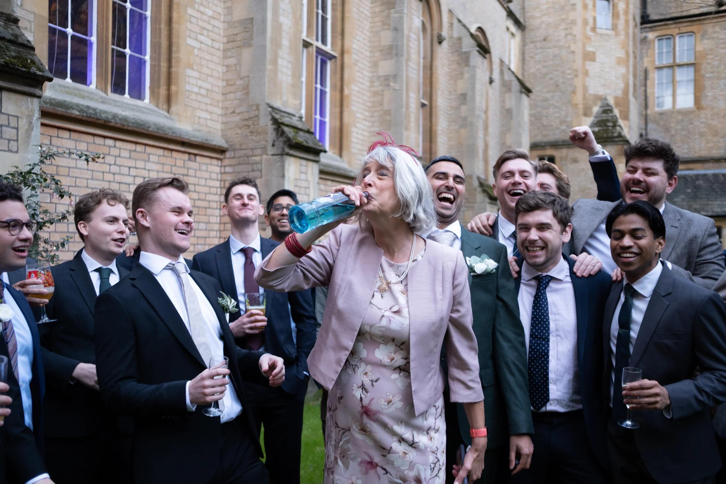 wedding photo of grooms fun having fun at london wedding venue