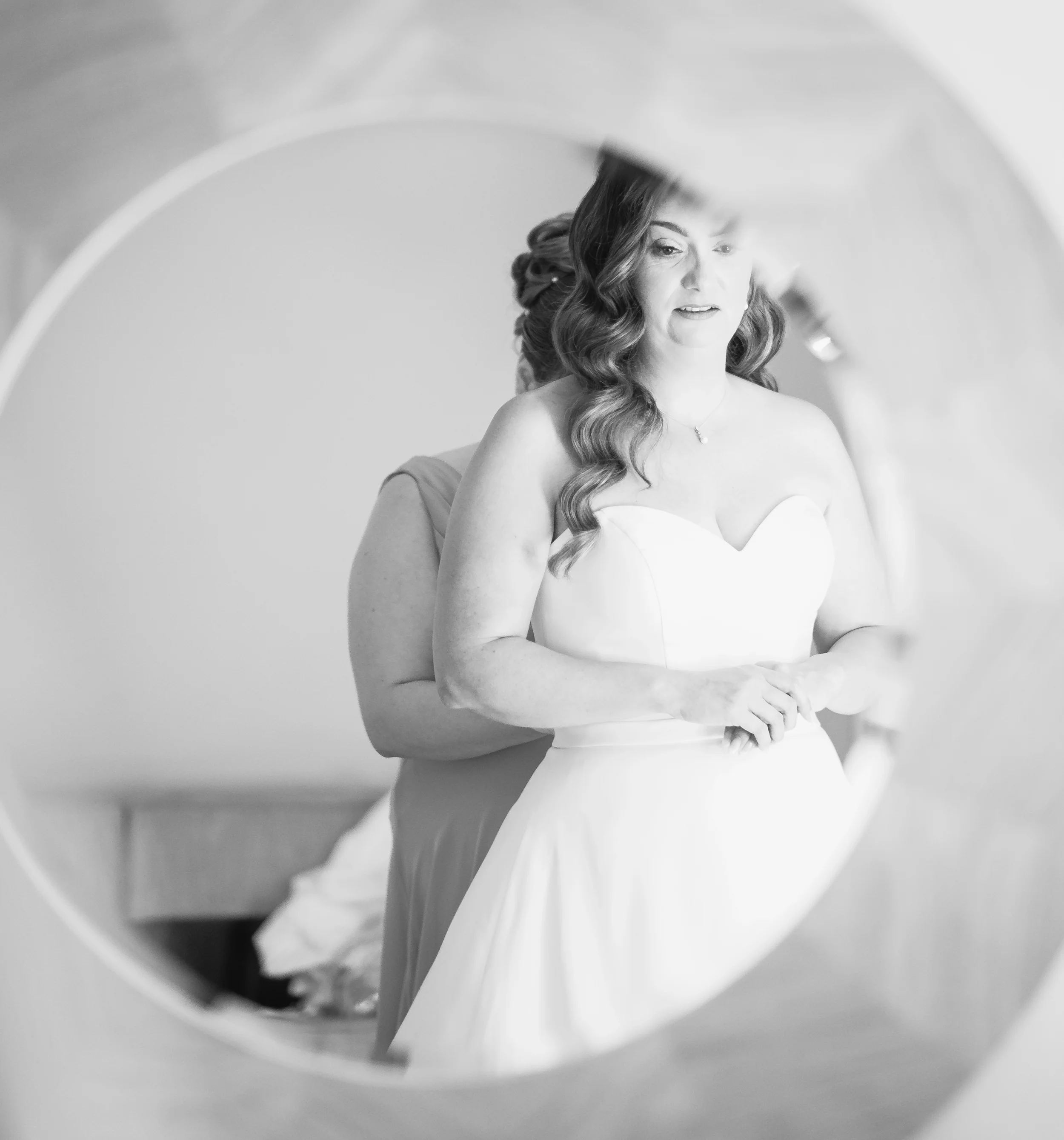 Wedding photographer Bedford at Tithe Barn Bedford bride getting ready in mirror