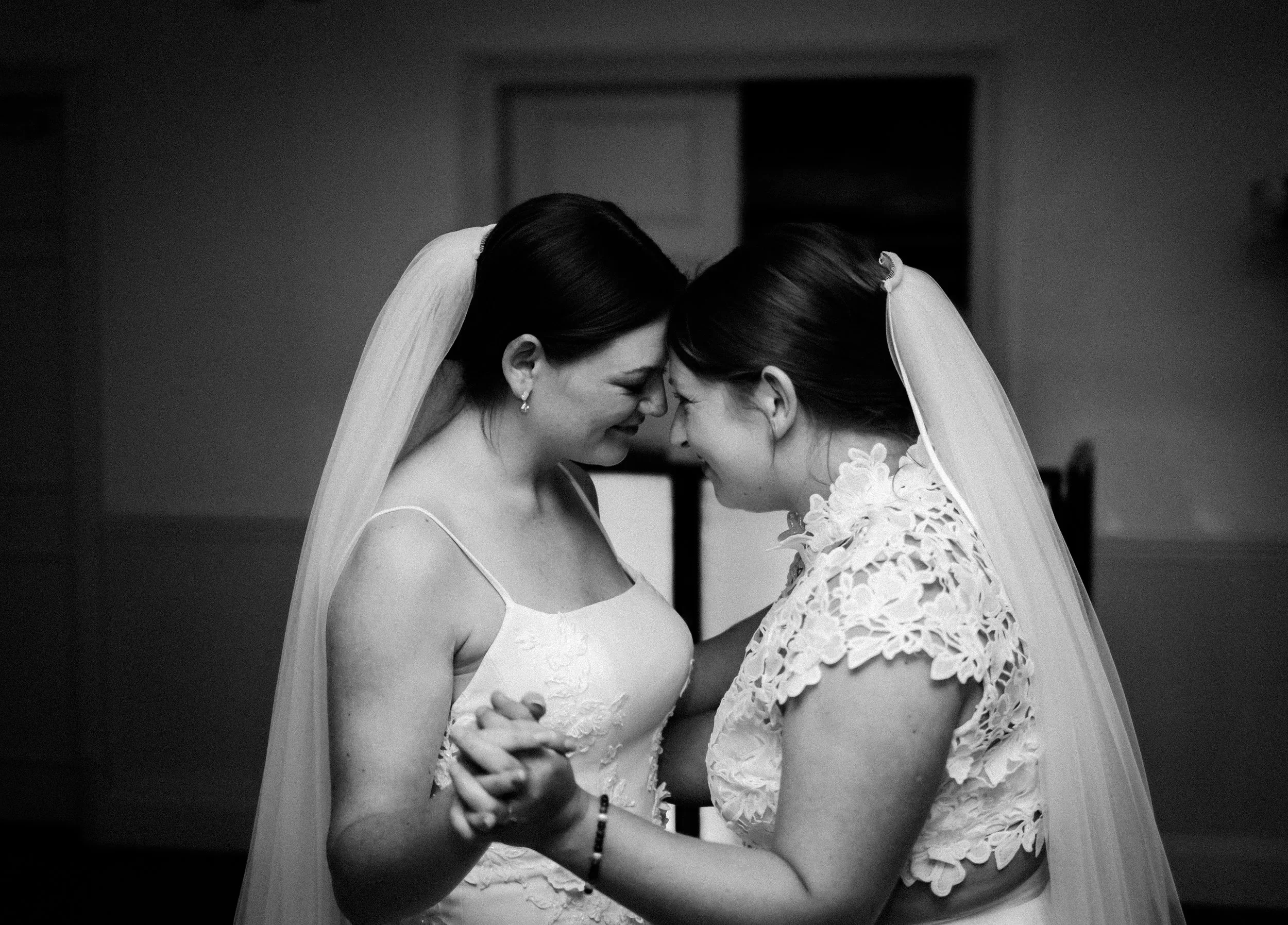 wedding photo of two brides sharing a loving moment on their wedding day-bedfordshire wedding photographer