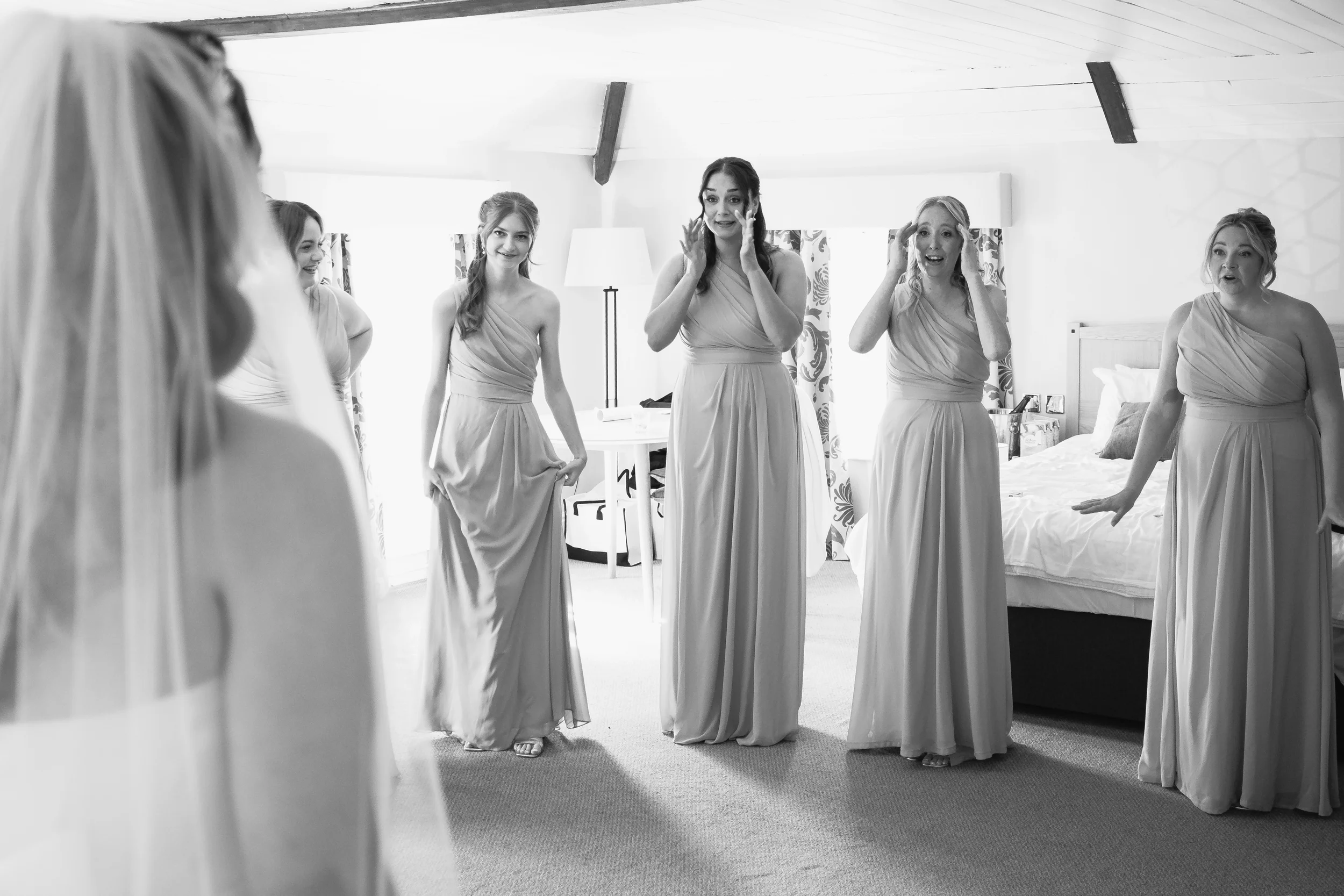 wedding photograph of the bridemaids reaction to seeing the bride in the dress for the first time-kiefullerphotography-bedfordshire wedding photographer