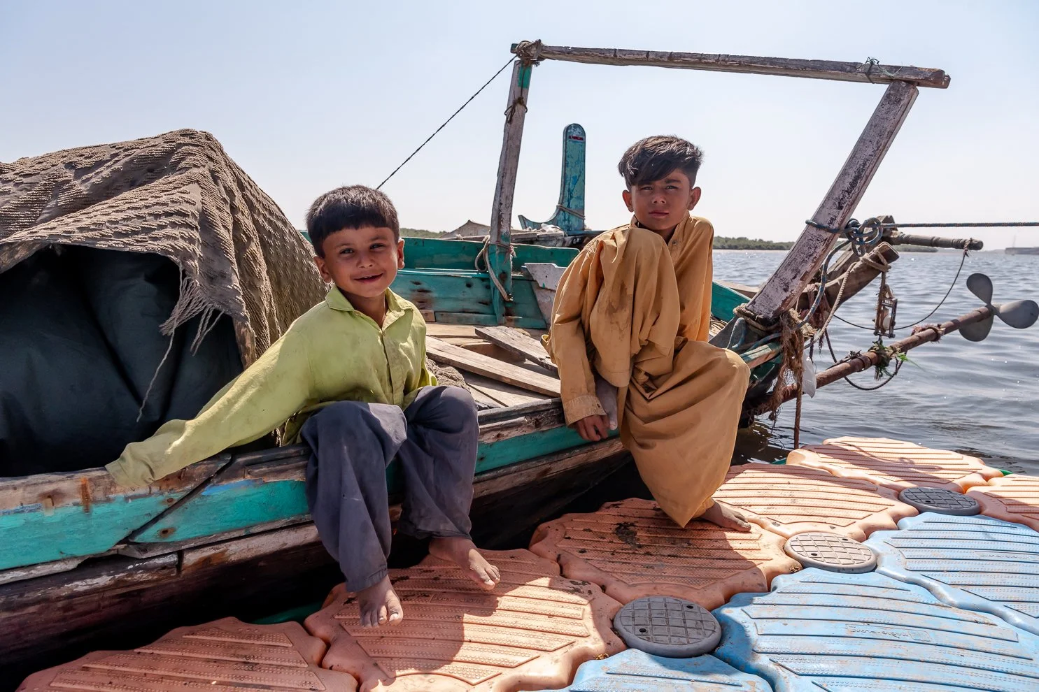 220316-Pakistan-training-fish-village-kids-boat.jpg
