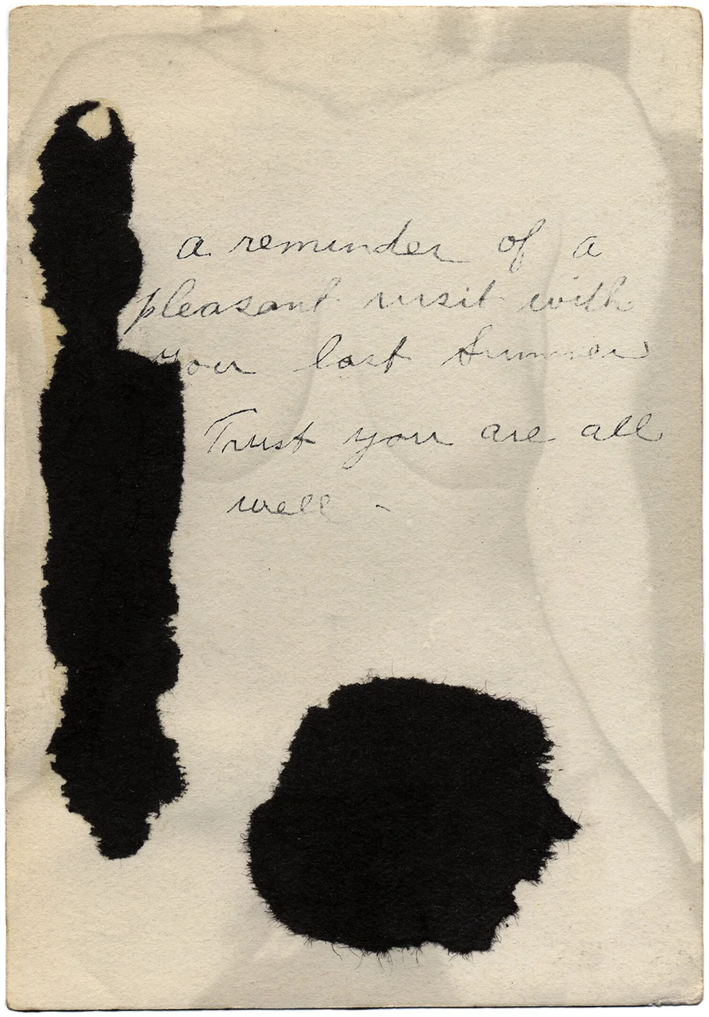 A vintage cream-colored page with handwritten cursive text and two abstract black ink shapes or stains—one vertical form on the left and a rounded form below.