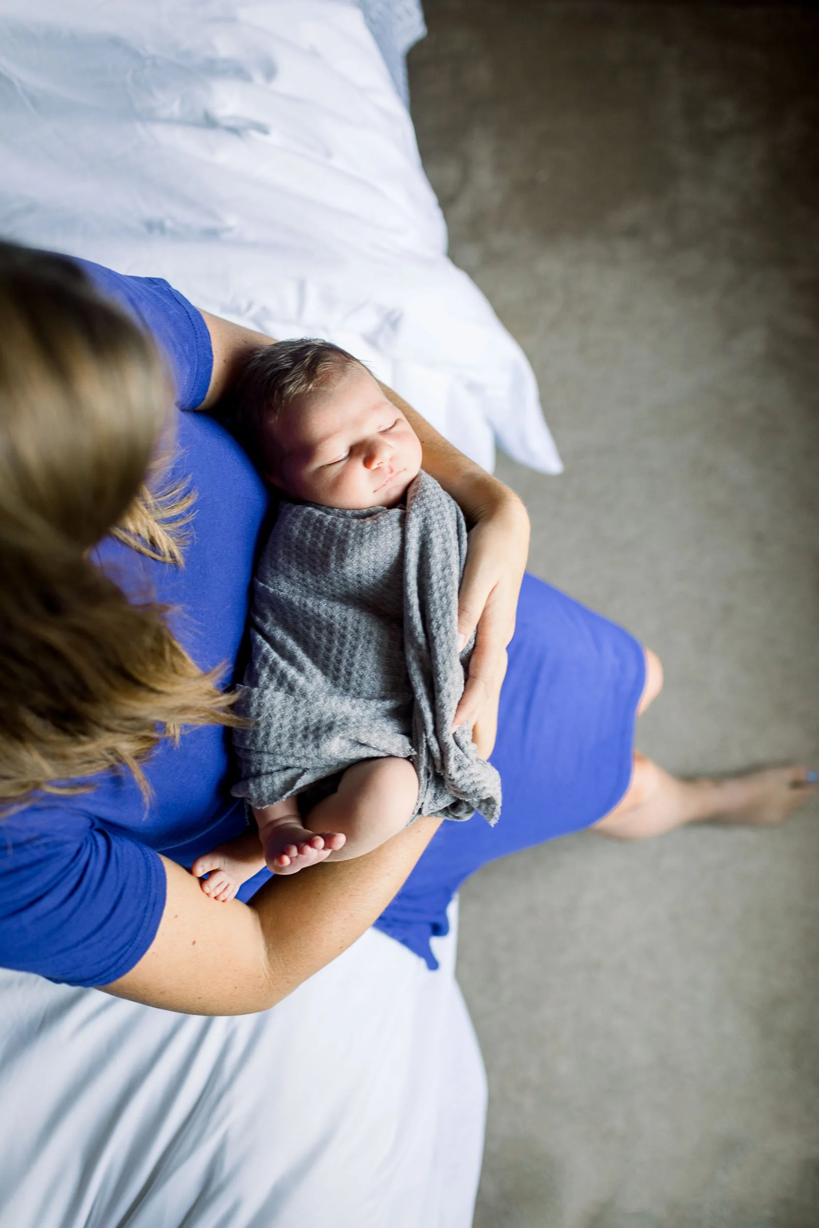 Chicago mother holding newborn baby in arms