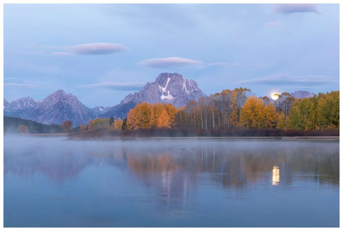 Oxbow Bend Moonset at Grand Teton National Park, with fog over Lake and Pink clouds overhead